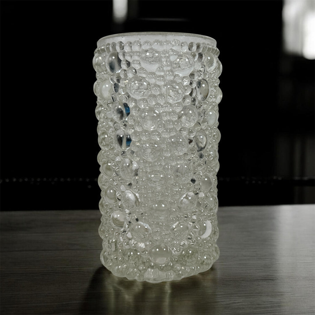 Mid-century modern clear bubble glass cylinder vase with Scandinavian style. Heavy textured art glass décor piece from the 1960s–70s.