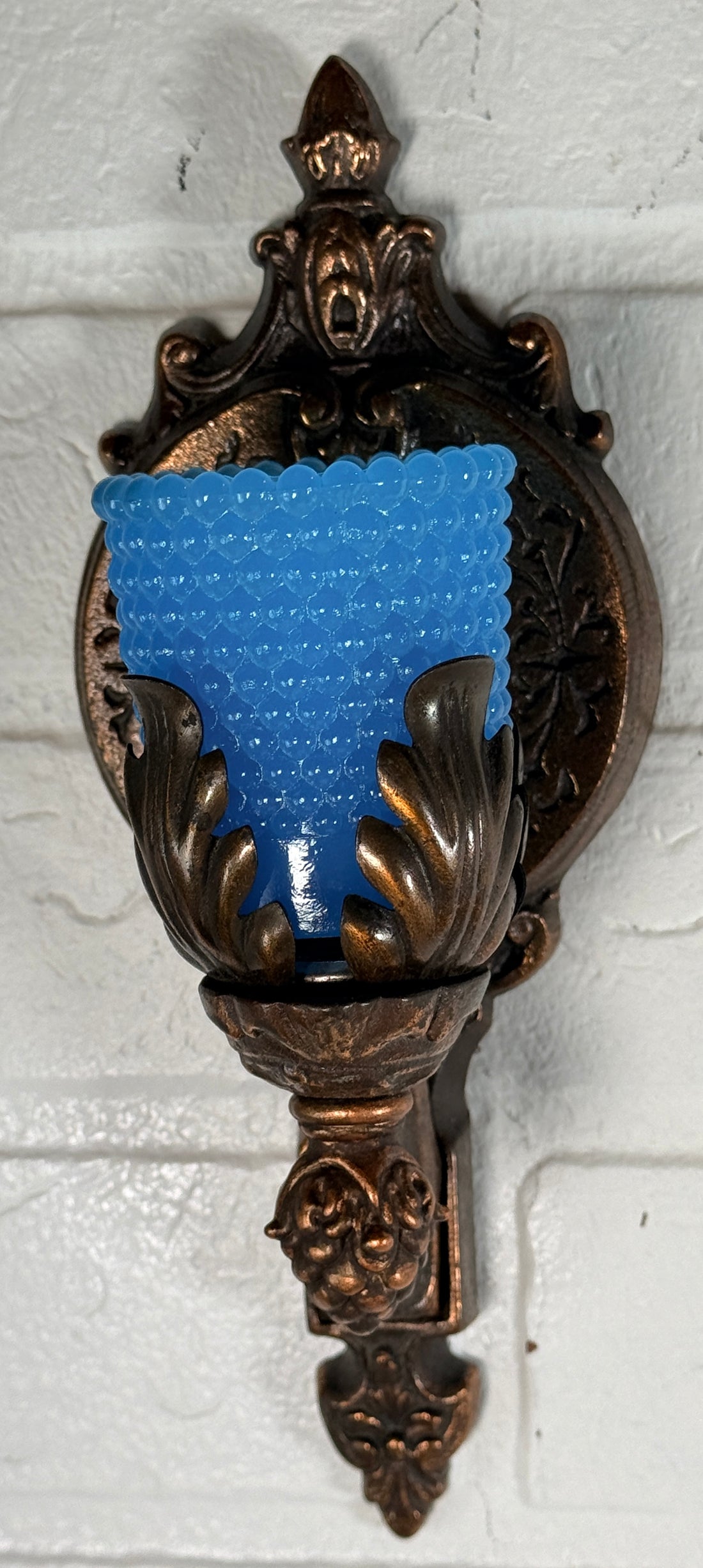 Vintage Hollywood Regency wall sconces pair with gold leaf finish and blue hobnail glass shades. Ornate cast metal accent lighting, 9.5 inch set of 2.