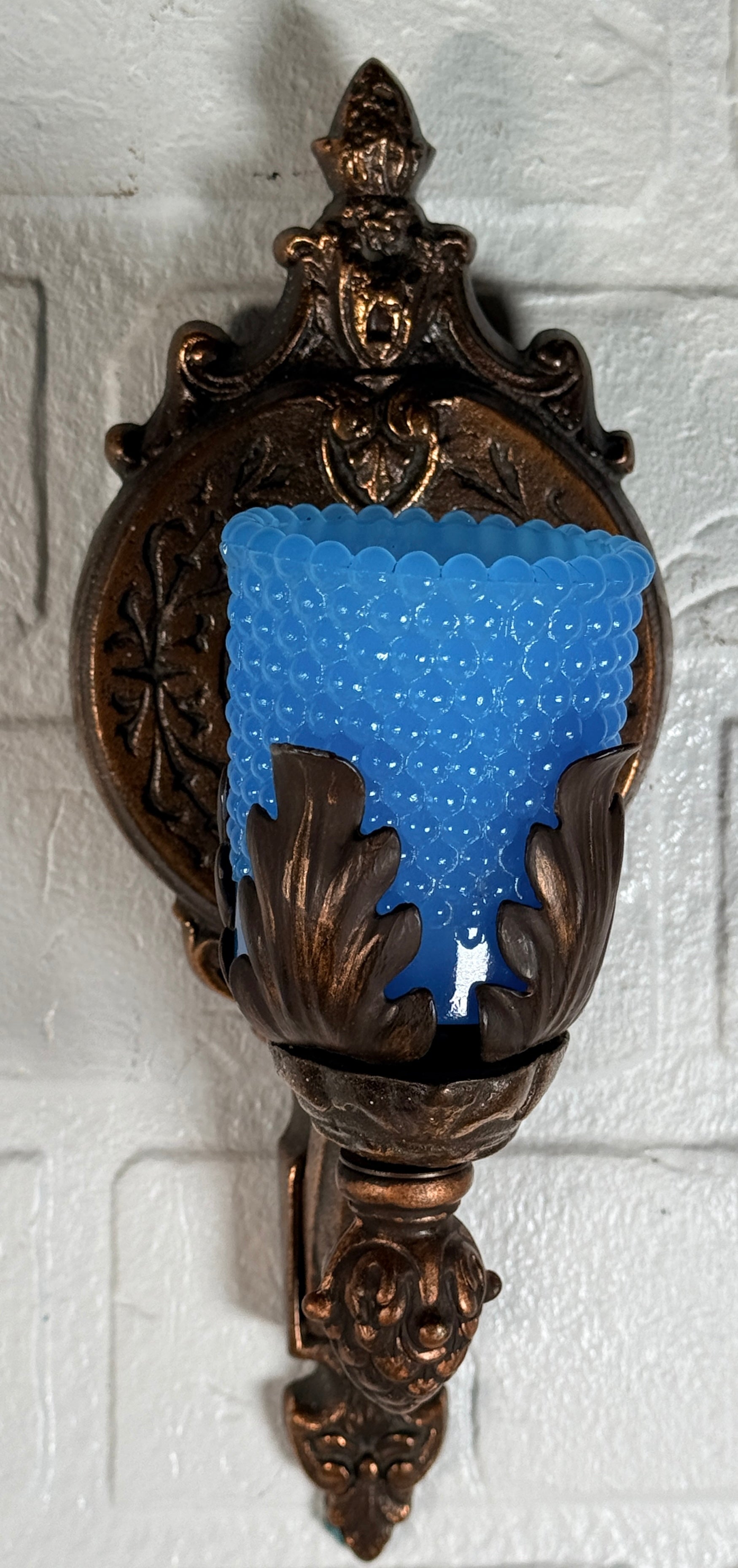 Vintage Hollywood Regency wall sconces pair with gold leaf finish and blue hobnail glass shades. Ornate cast metal accent lighting, 9.5 inch set of 2.