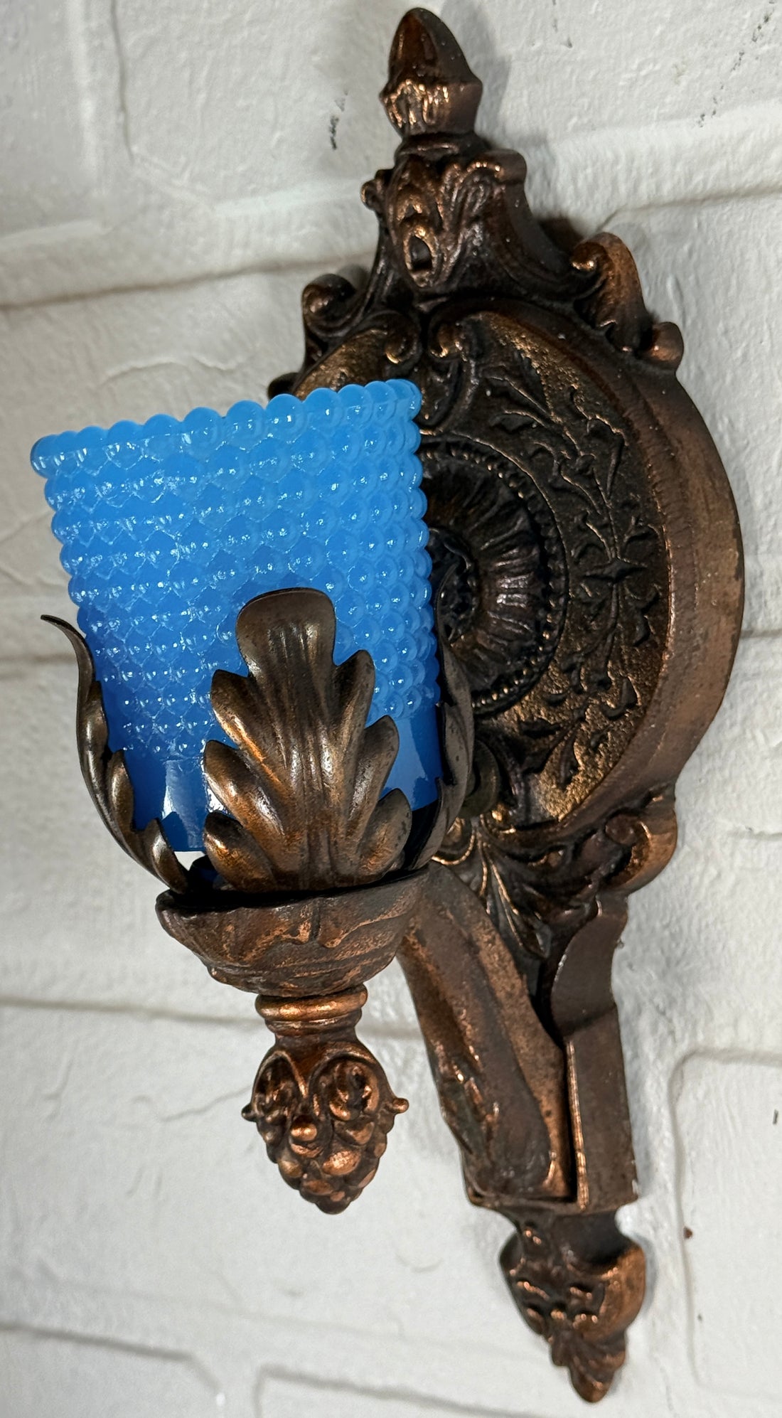 Vintage Hollywood Regency wall sconces pair with gold leaf finish and blue hobnail glass shades. Ornate cast metal accent lighting, 9.5 inch set of 2.