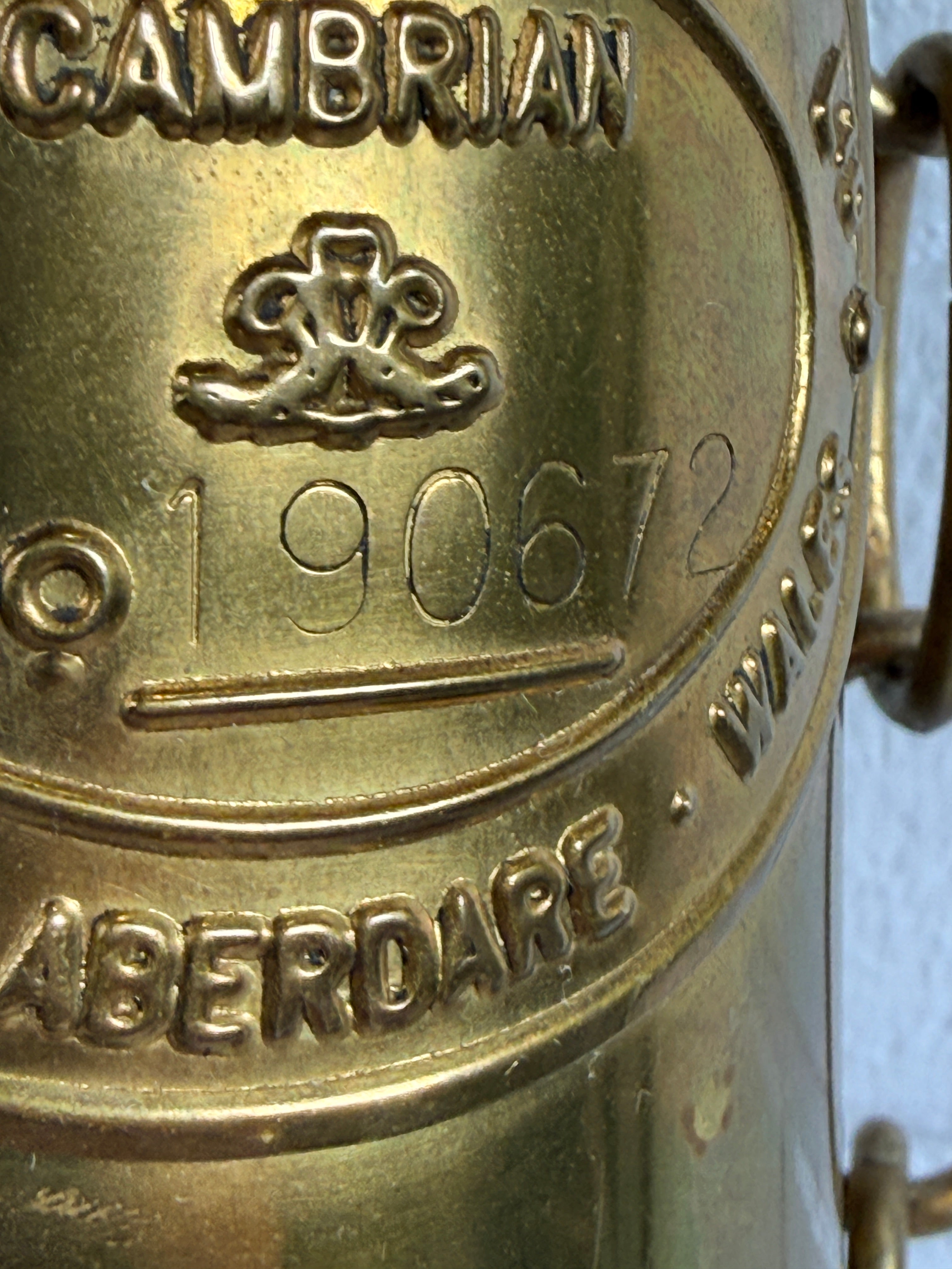 Authentic Thomas Williams Cambrian Welsh miners lamp in brass with chain. Classic industrial decor collectible marked Aberdare Wales.
