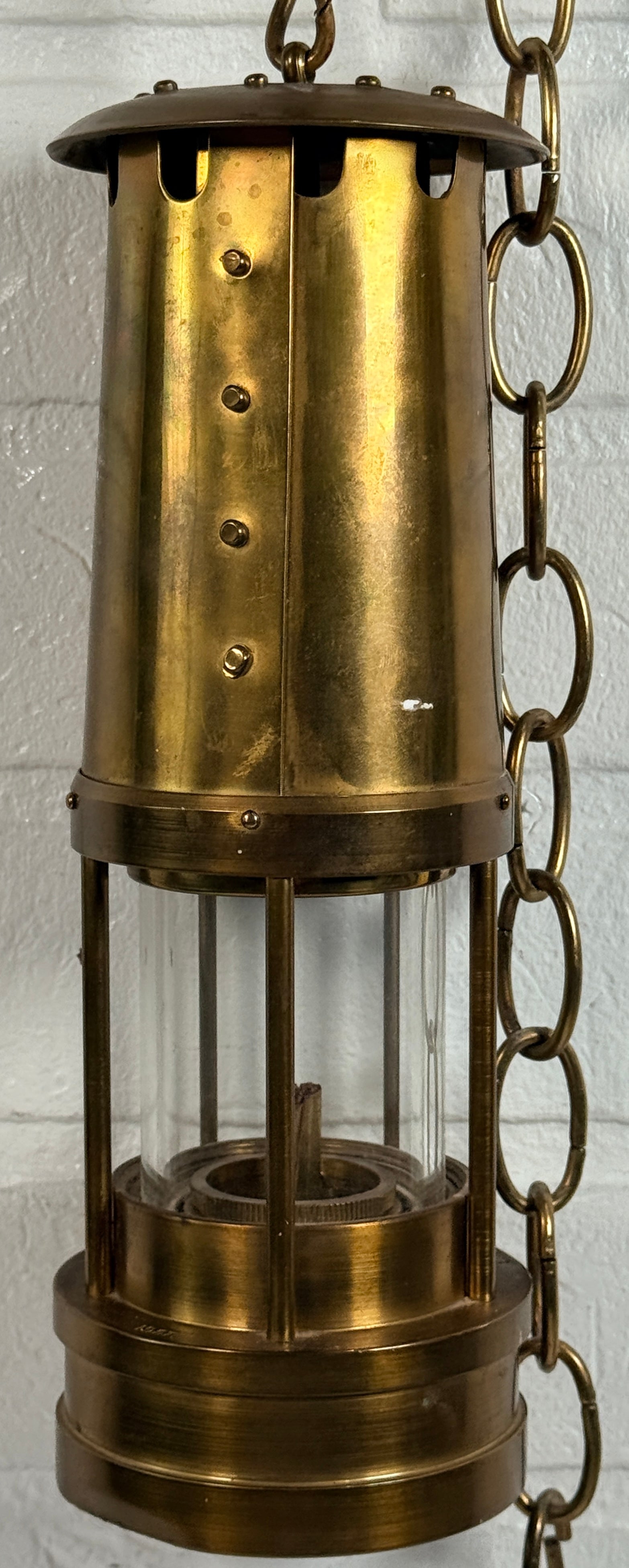 Authentic Thomas Williams Cambrian Welsh miners lamp in brass with chain. Classic industrial decor collectible marked Aberdare Wales.