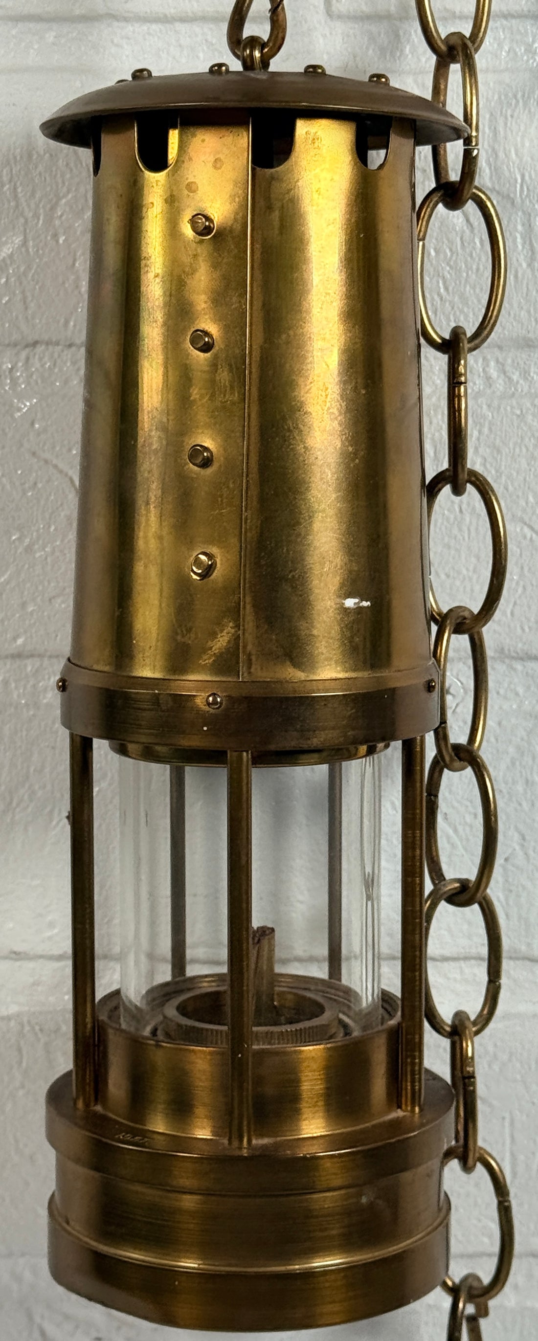 Authentic Thomas Williams Cambrian Welsh miners lamp in brass with chain. Classic industrial decor collectible marked Aberdare Wales.
