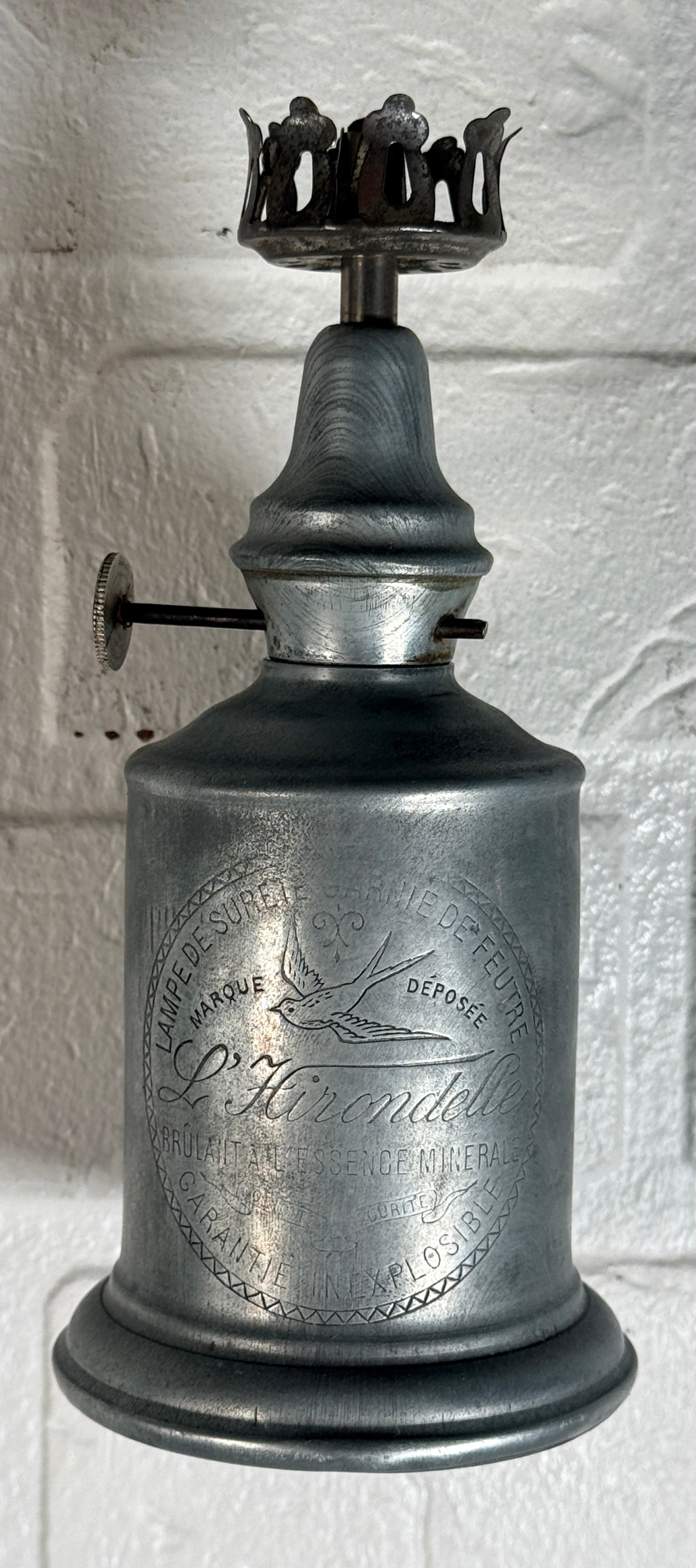 Antique French L’Hirondelle engraved spirit lamp with swallow logo, rare early 1900s industrial décor collectible from France.