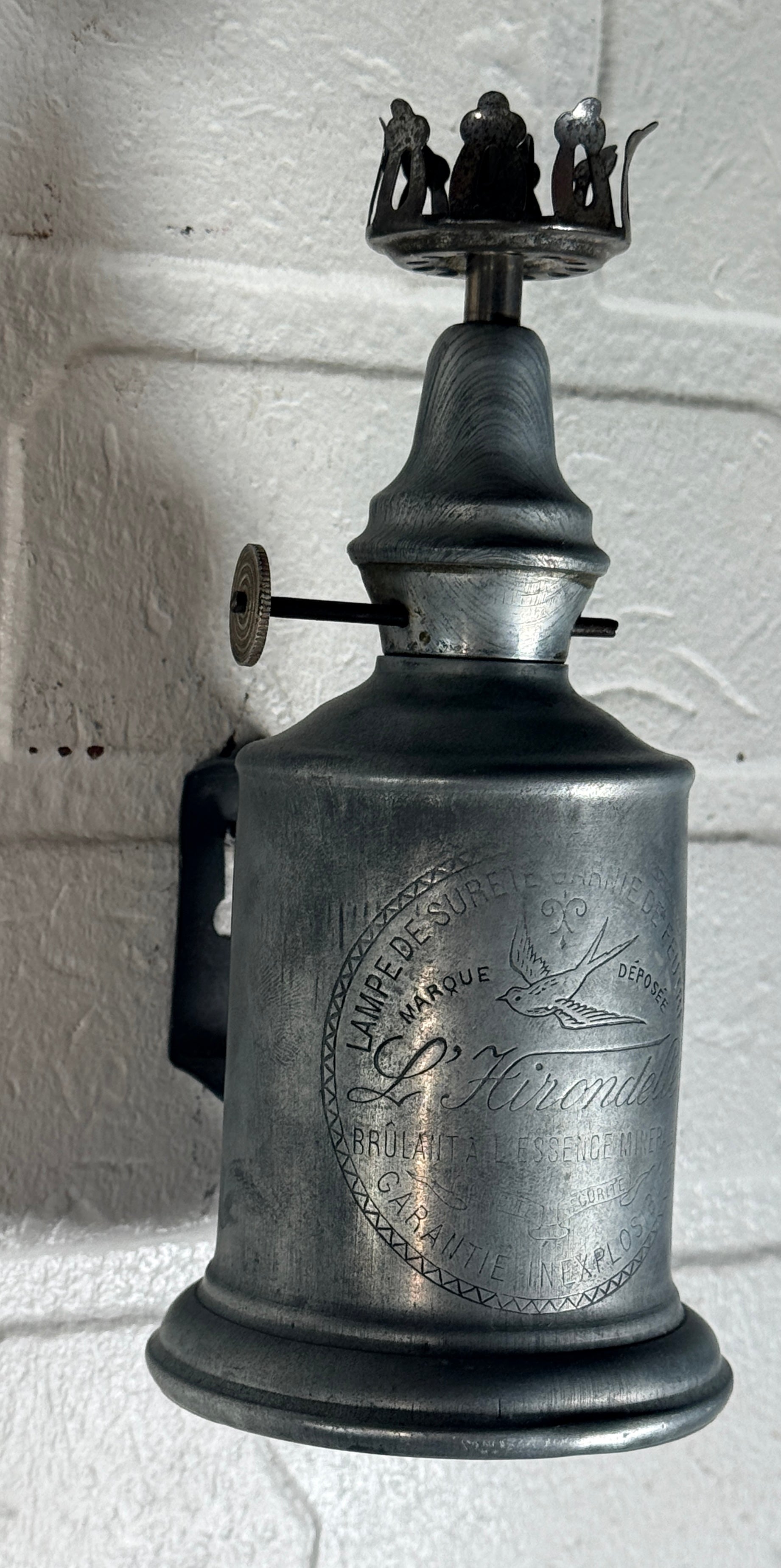Antique French L’Hirondelle engraved spirit lamp with swallow logo, rare early 1900s industrial décor collectible from France.