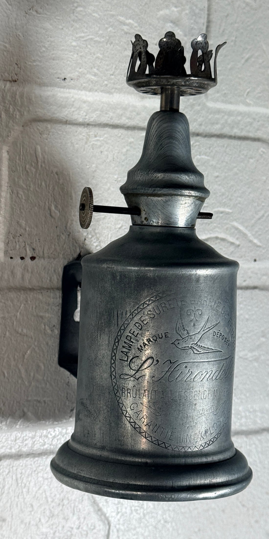 Antique French L’Hirondelle engraved spirit lamp with swallow logo, rare early 1900s industrial décor collectible from France.