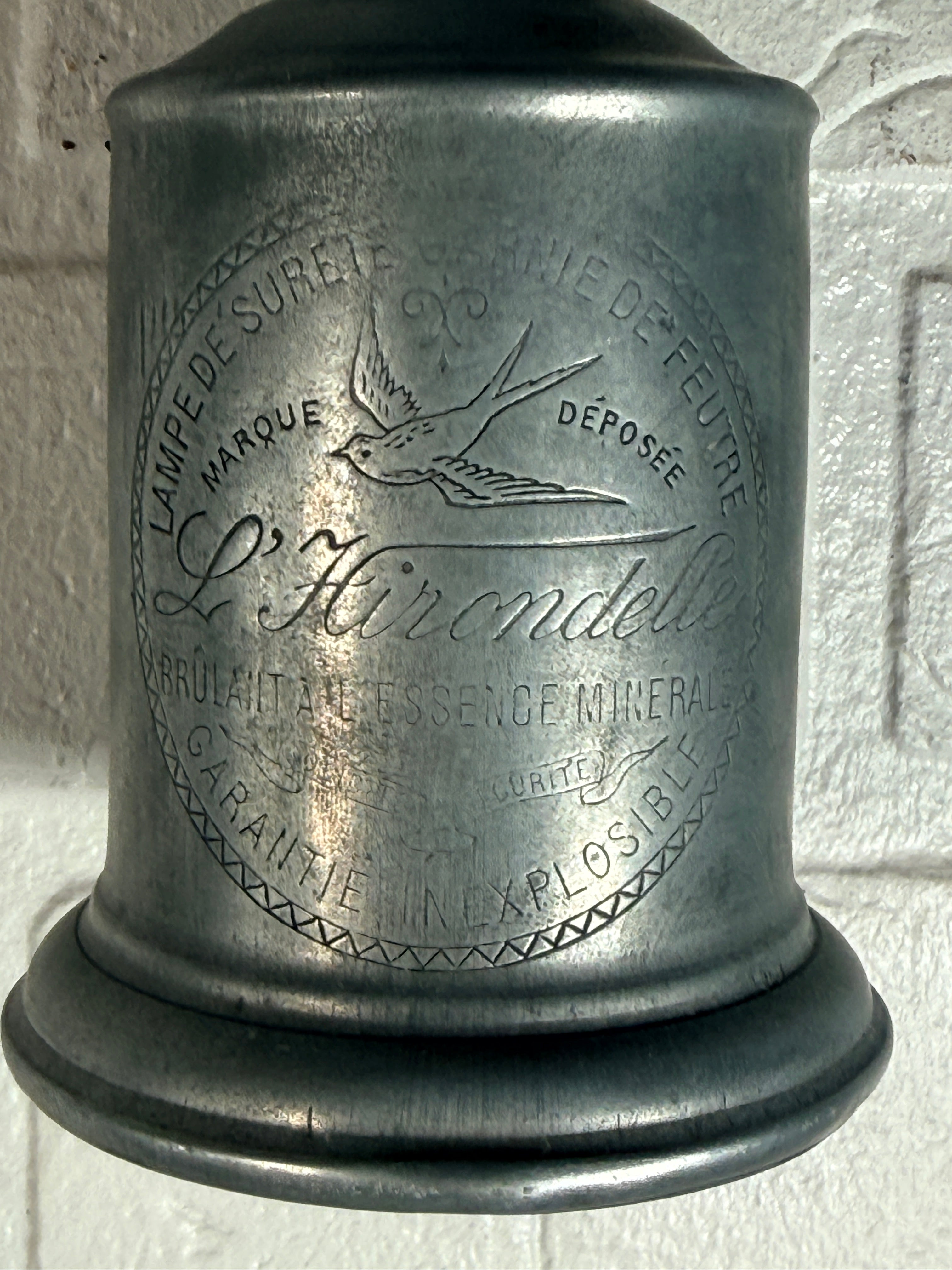 Antique French L’Hirondelle engraved spirit lamp with swallow logo, rare early 1900s industrial décor collectible from France.