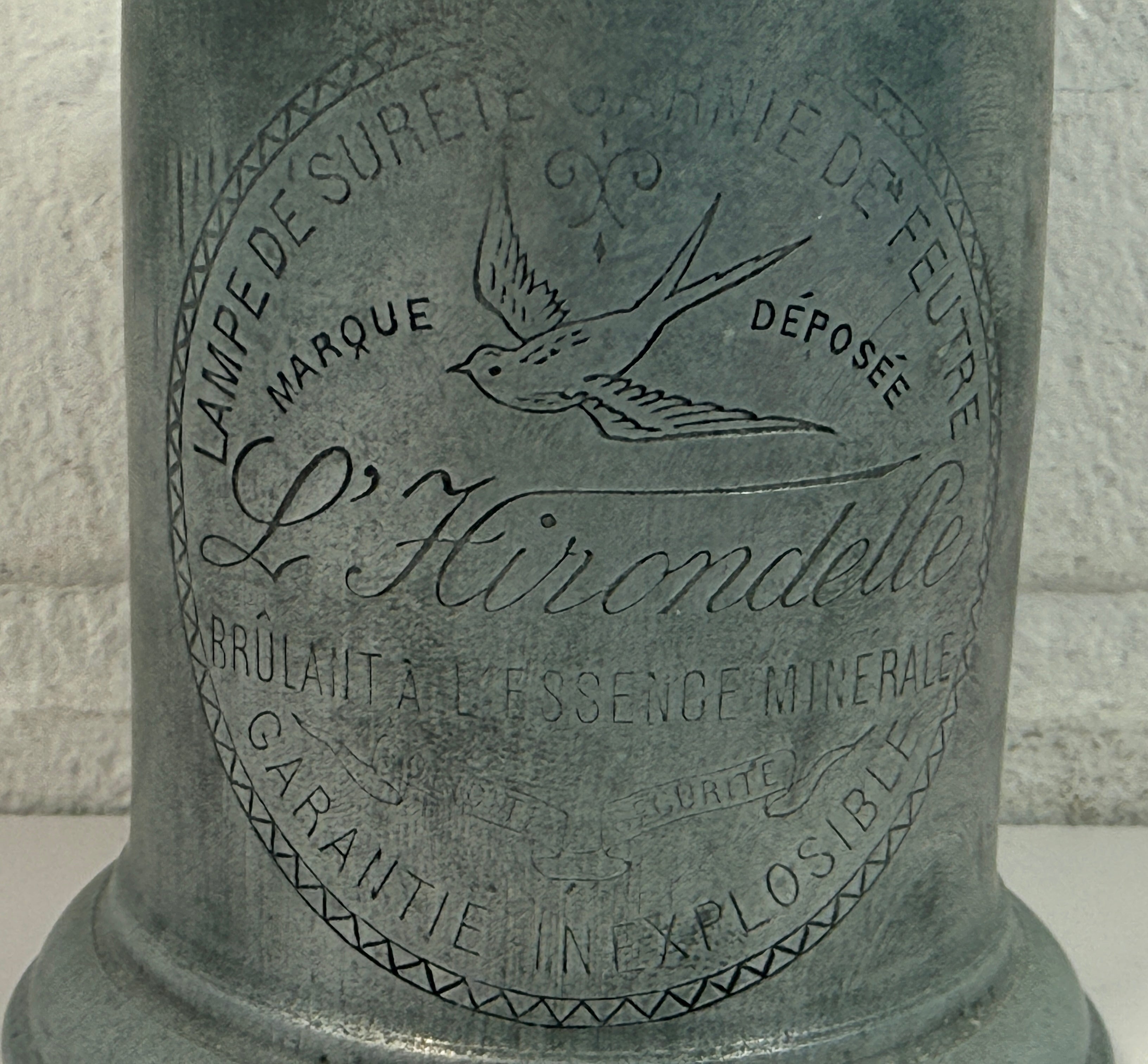 Antique French L’Hirondelle engraved spirit lamp with swallow logo, rare early 1900s industrial décor collectible from France.