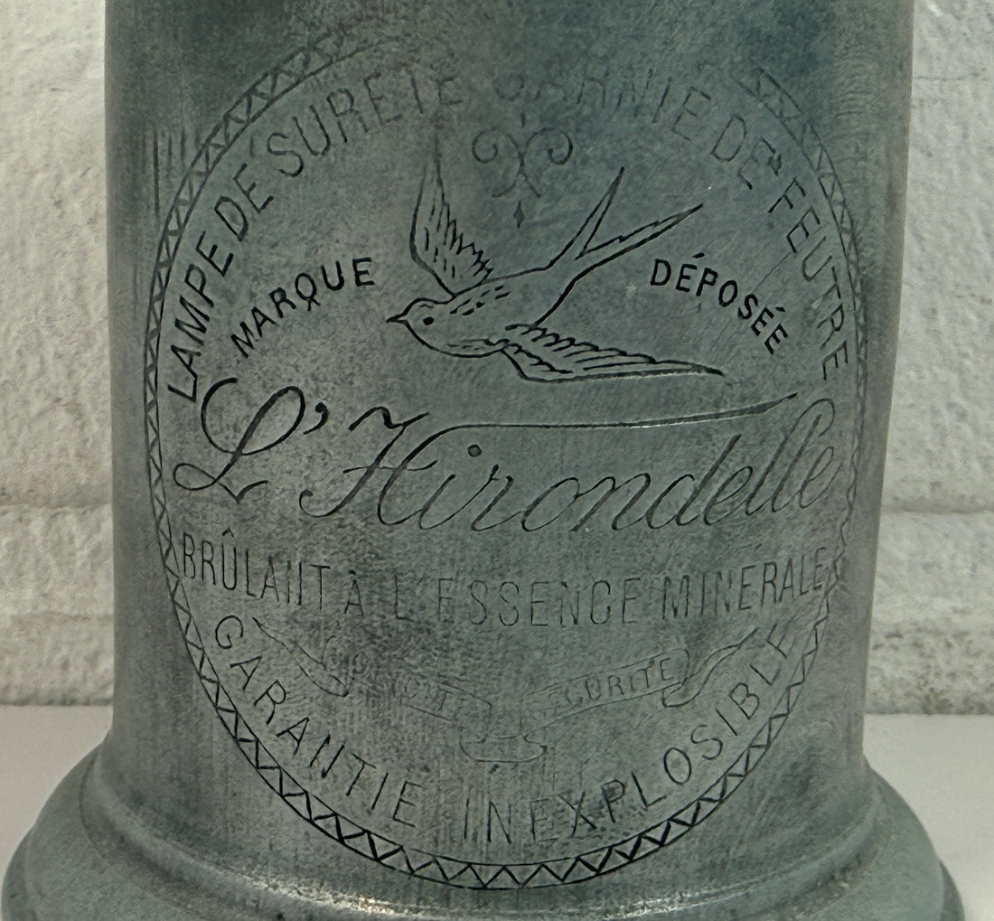 Antique French L’Hirondelle engraved spirit lamp with swallow logo, rare early 1900s industrial décor collectible from France.