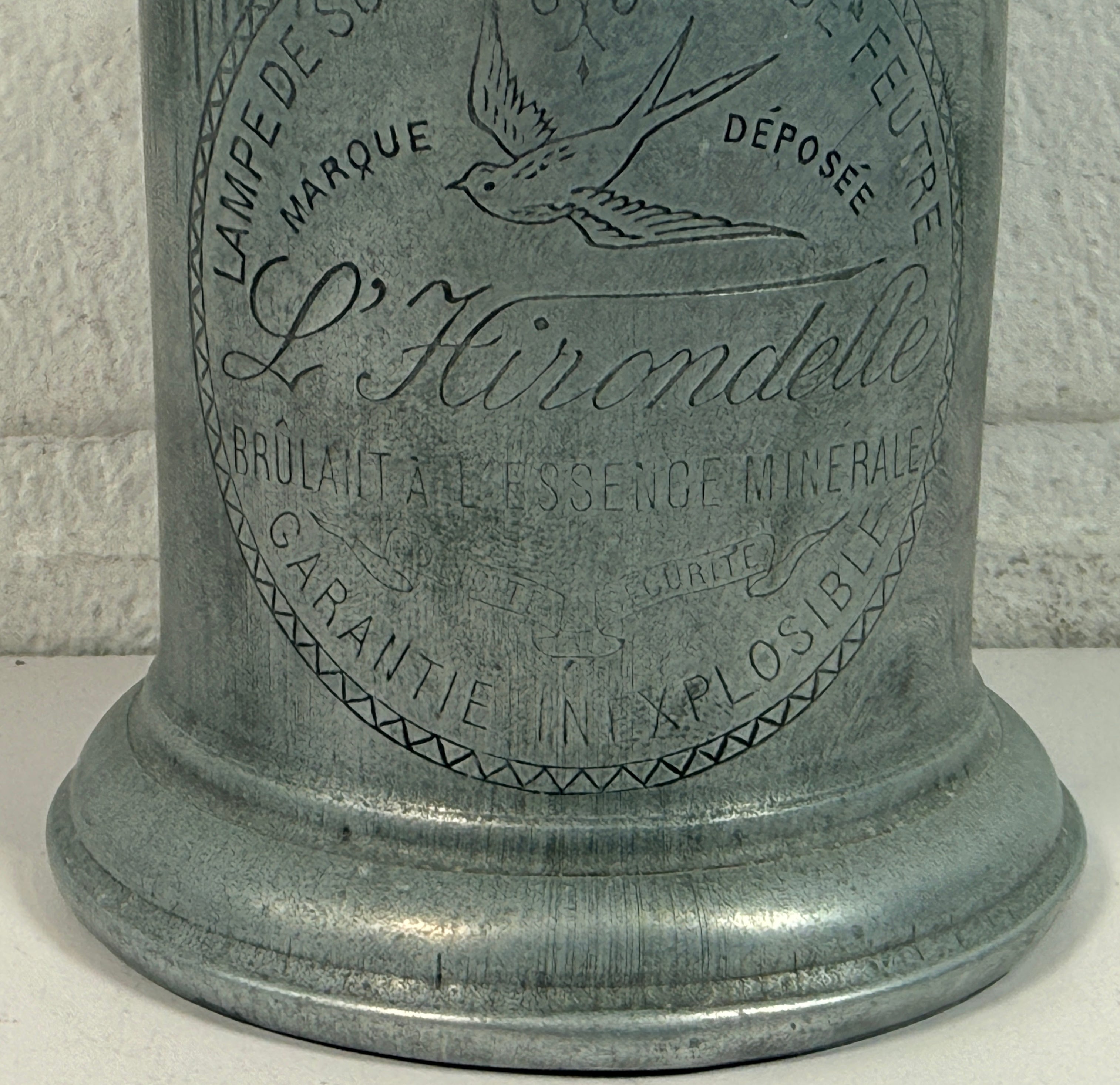 Antique French L’Hirondelle engraved spirit lamp with swallow logo, rare early 1900s industrial décor collectible from France.