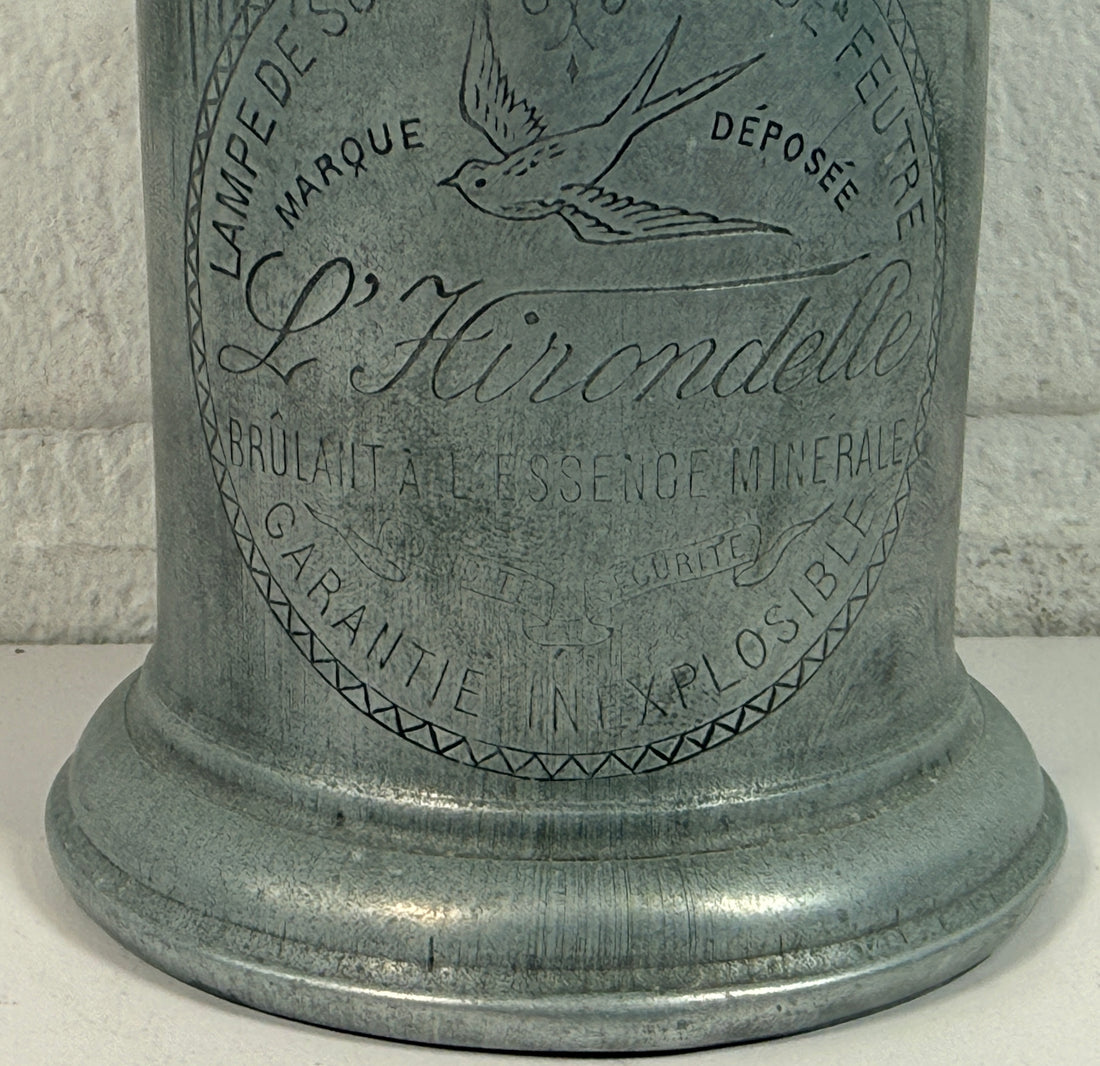 Antique French L’Hirondelle engraved spirit lamp with swallow logo, rare early 1900s industrial décor collectible from France.