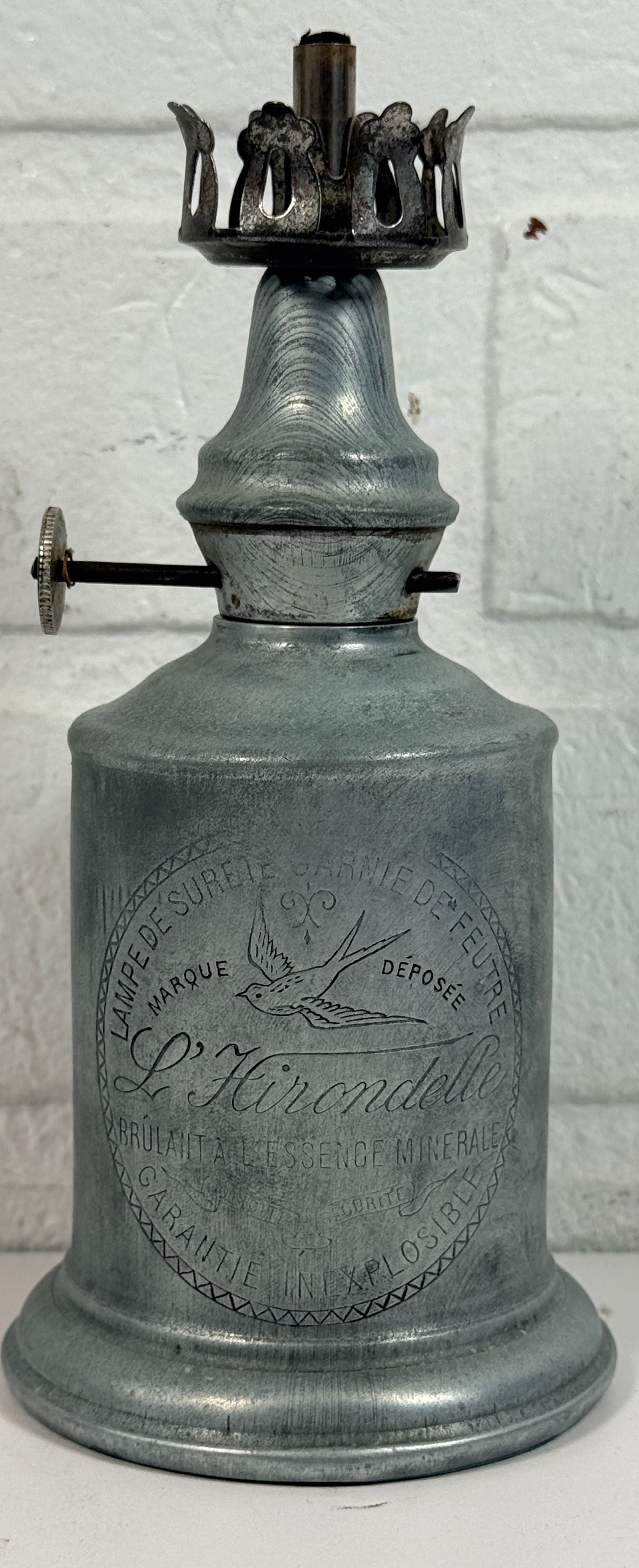 Antique French L’Hirondelle engraved spirit lamp with swallow logo, rare early 1900s industrial décor collectible from France.