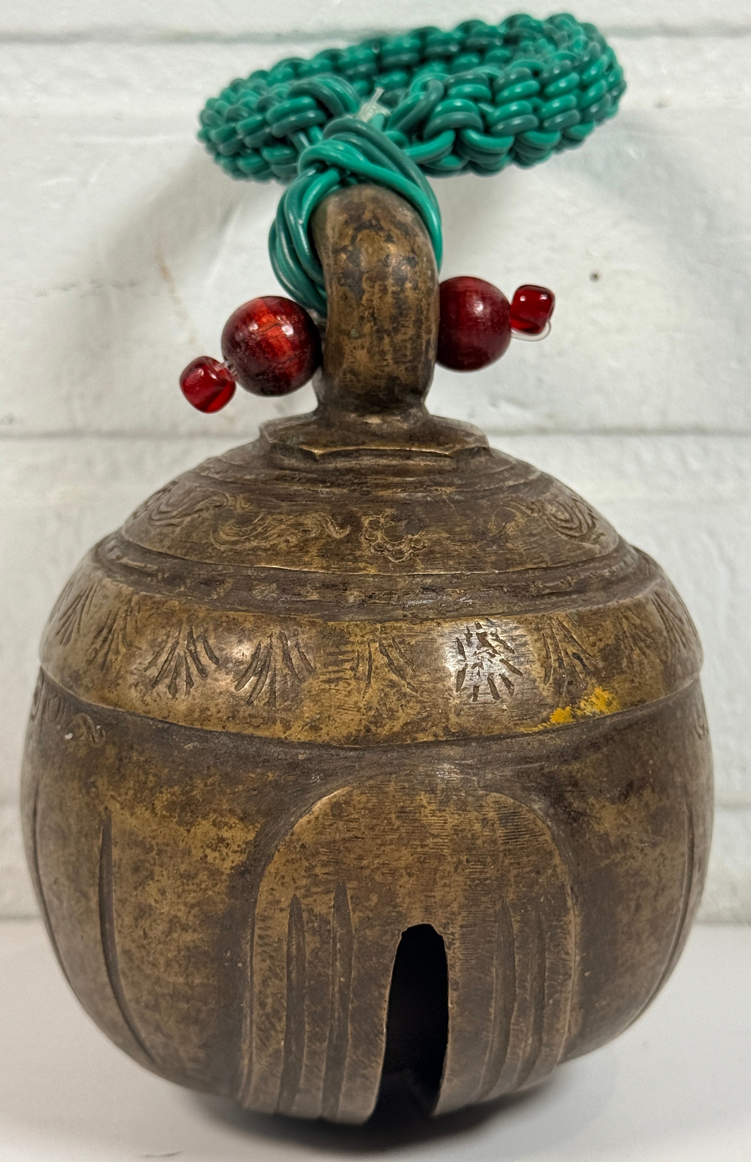 Vintage Burmese elephant bell in cast bronze with aged patina. Traditional Myanmar temple livestock bell with clapper, decorative folk art collectible.