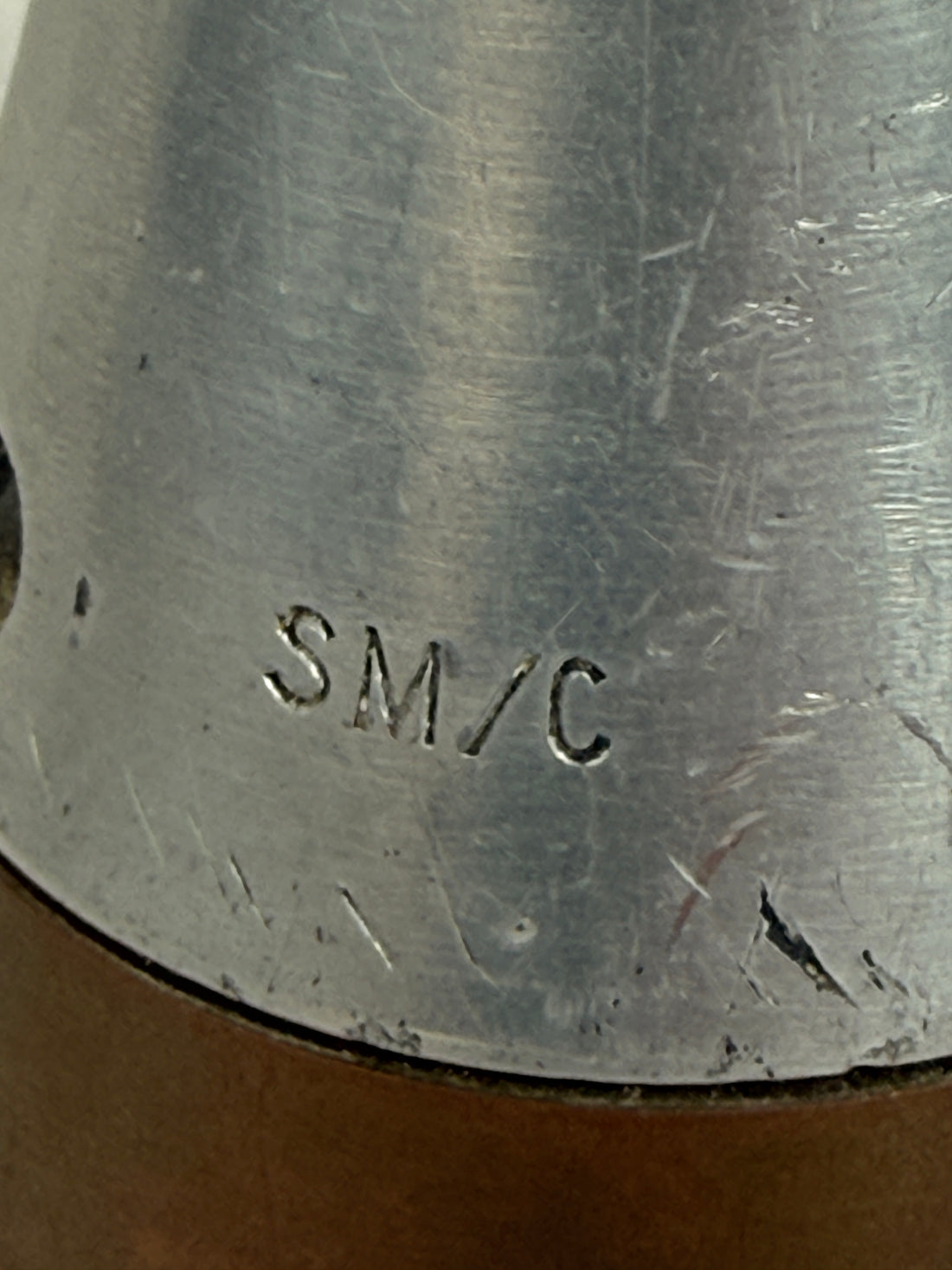 WWII British mechanical time fuze Mk IV brass and aluminum artillery nose assembly. Authentic militaria collectible with timer dial and industrial display appeal.
