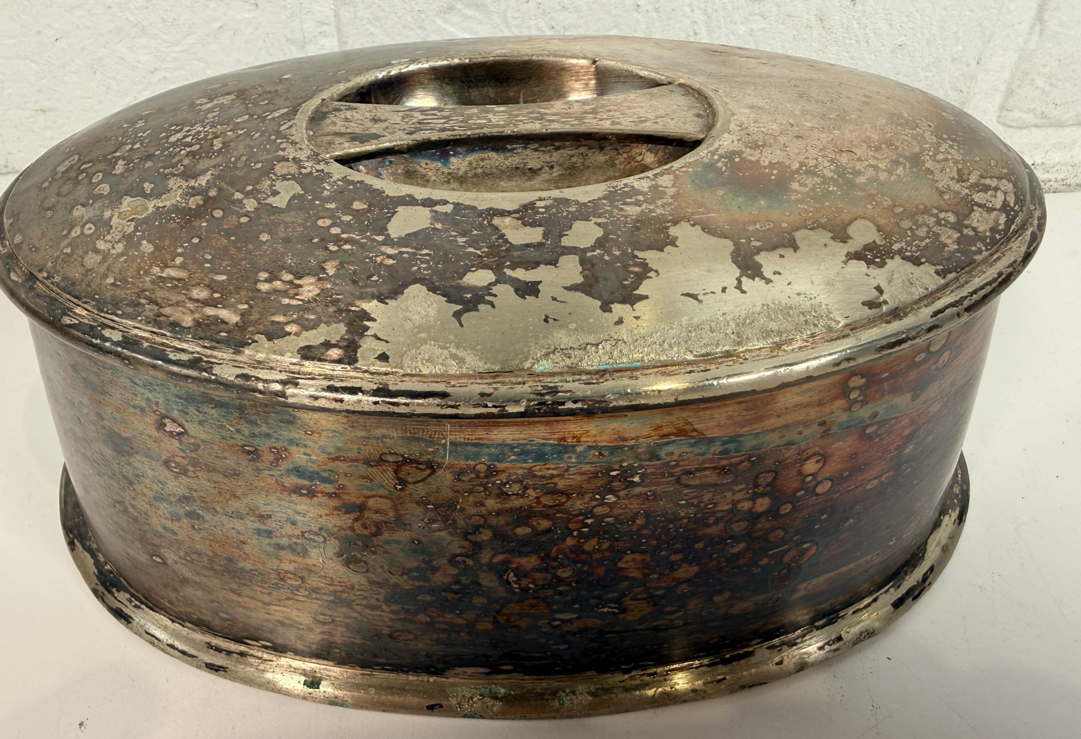 Vintage silverplate silent butler crumb catcher with oval form and rich aged patina. Elegant mid-century dining accessory and collectible tableware piece.