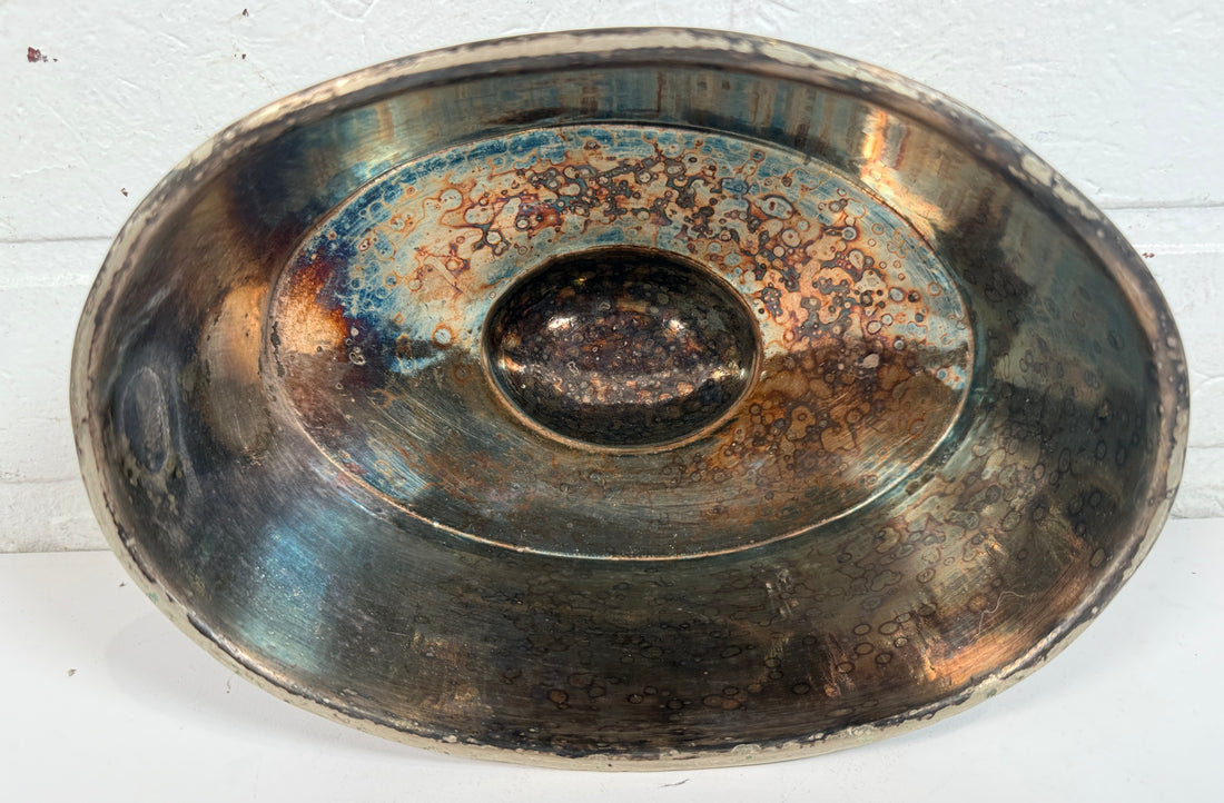 Vintage silverplate silent butler crumb catcher with oval form and rich aged patina. Elegant mid-century dining accessory and collectible tableware piece.