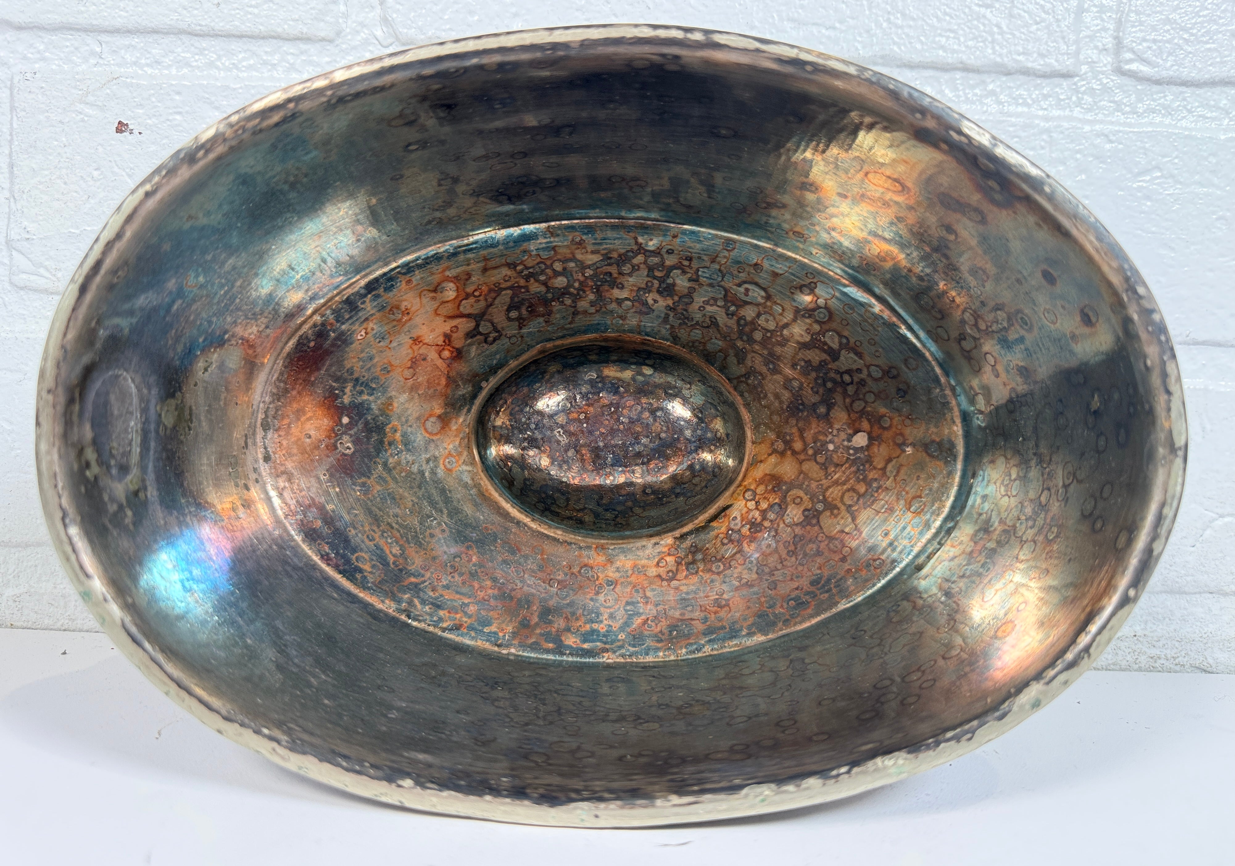 Vintage silverplate silent butler crumb catcher with oval form and rich aged patina. Elegant mid-century dining accessory and collectible tableware piece.