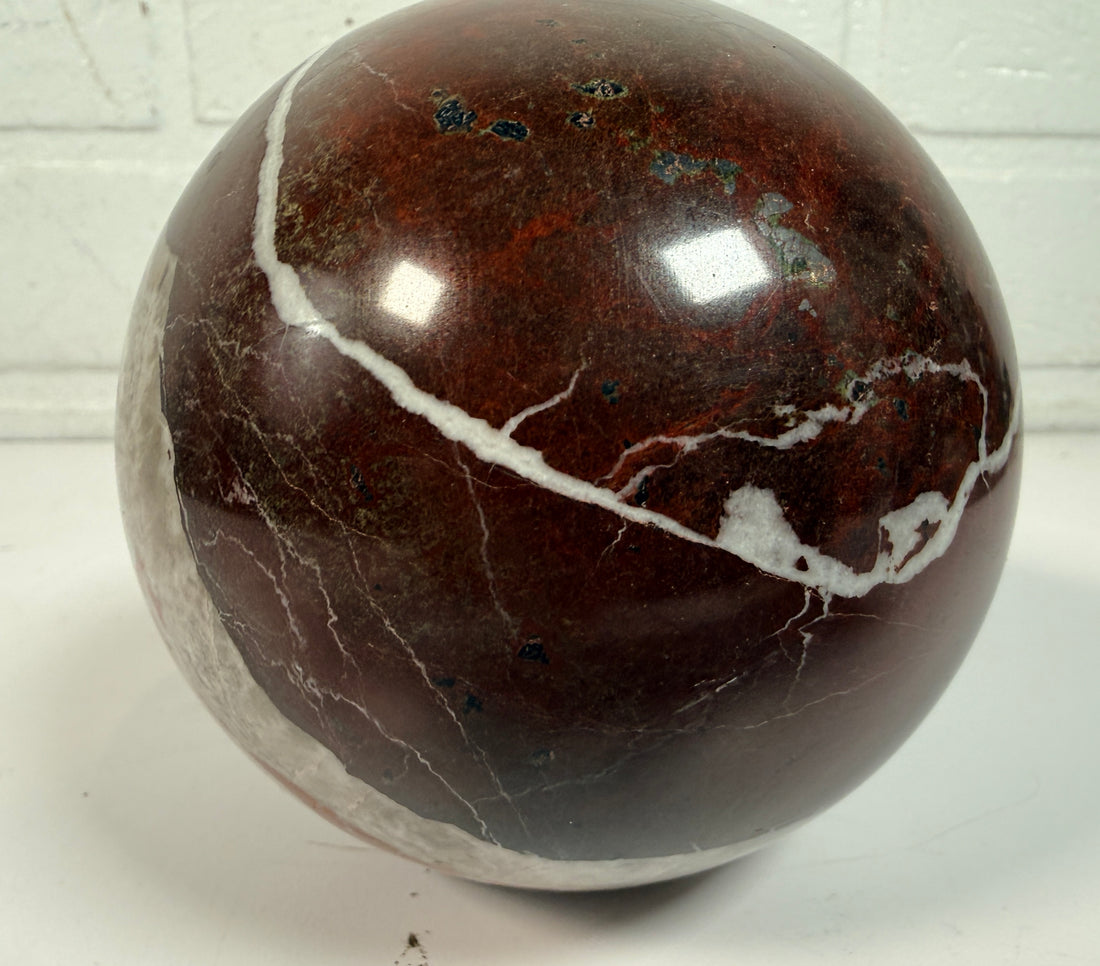 Large 4 inch Zebra Jasper sphere with rich red and white banding. Heavy polished natural stone orb, ideal for décor, gifting, or collectors.