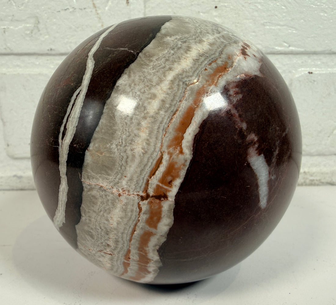 Large 4 inch Zebra Jasper sphere with rich red and white banding. Heavy polished natural stone orb, ideal for décor, gifting, or collectors.