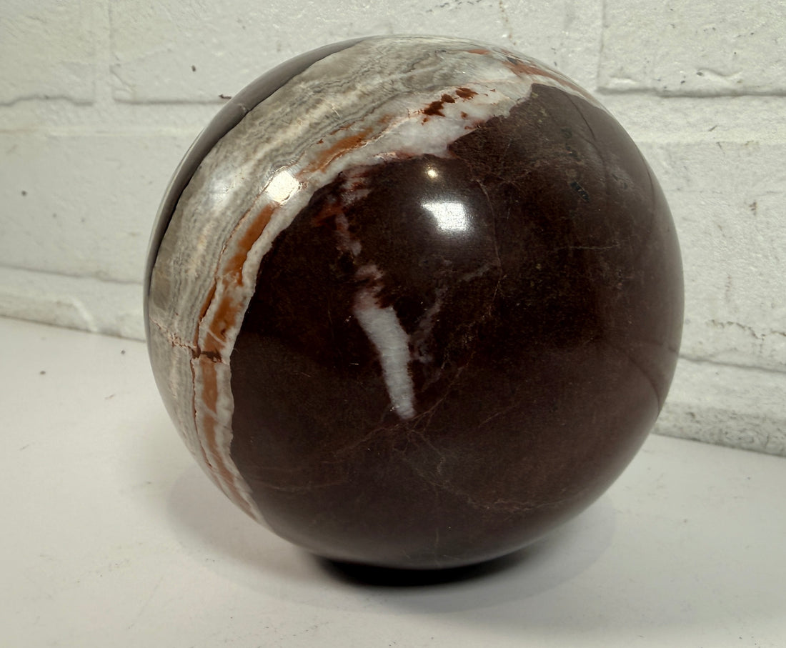 Large 4 inch Zebra Jasper sphere with rich red and white banding. Heavy polished natural stone orb, ideal for décor, gifting, or collectors.