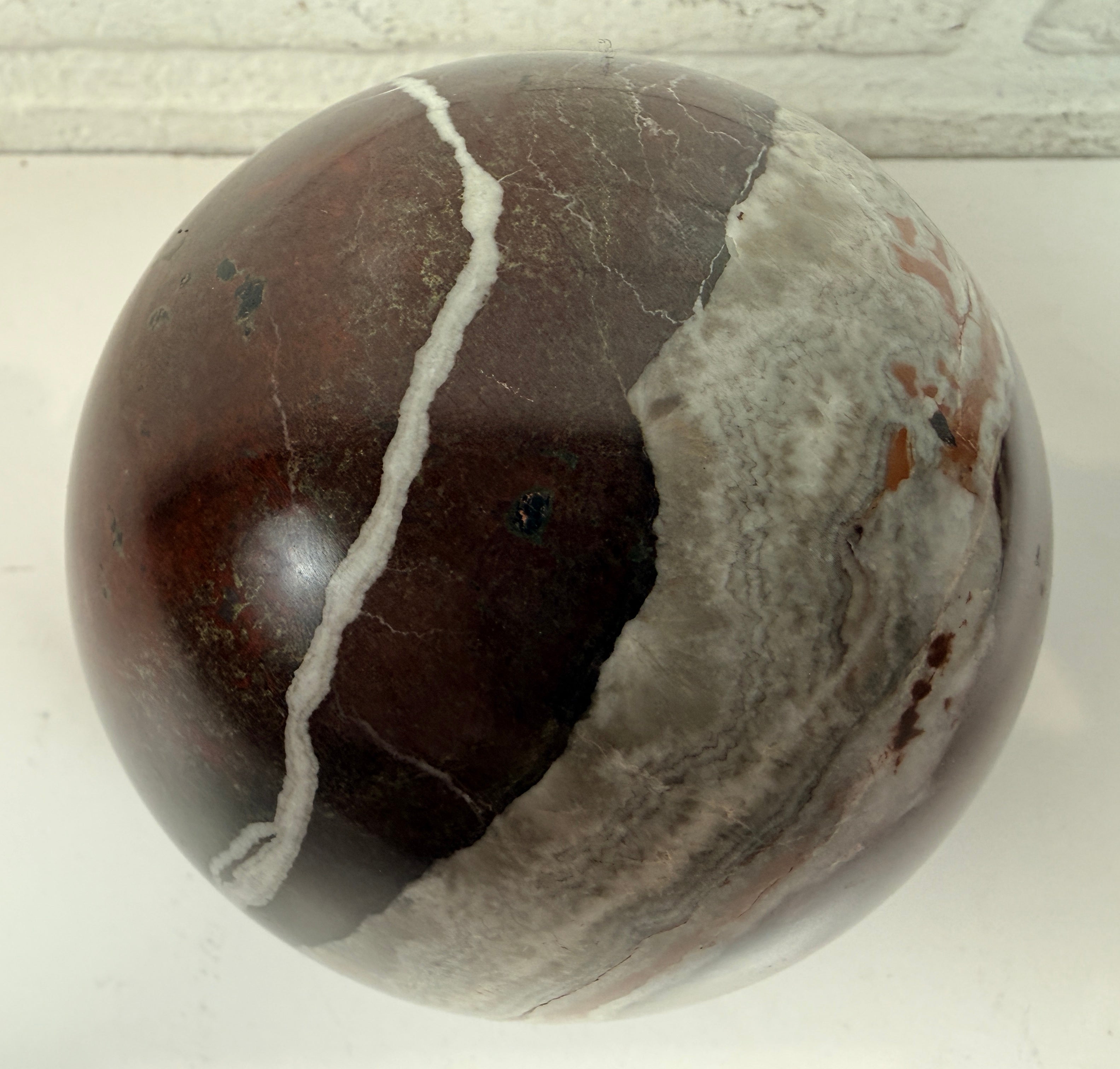 Large 4 inch Zebra Jasper sphere with rich red and white banding. Heavy polished natural stone orb, ideal for décor, gifting, or collectors.