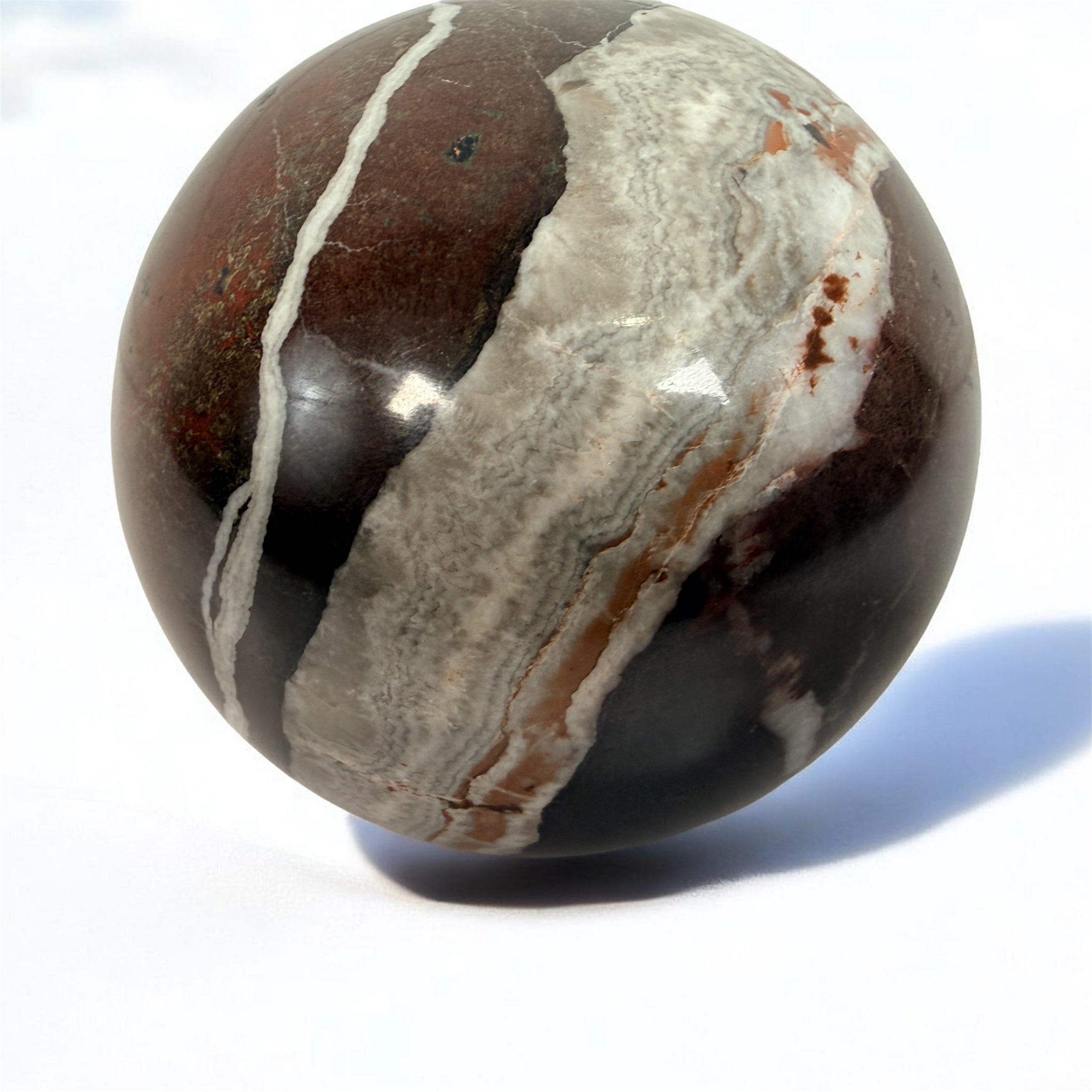 Large 4 inch Zebra Jasper sphere with rich red and white banding. Heavy polished natural stone orb, ideal for décor, gifting, or collectors.