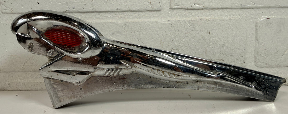 Vintage Dodge Ram hood ornament with red eyes, chrome mascot from the 1950s. Rare automobilia collectible for restoration, garage décor, or display