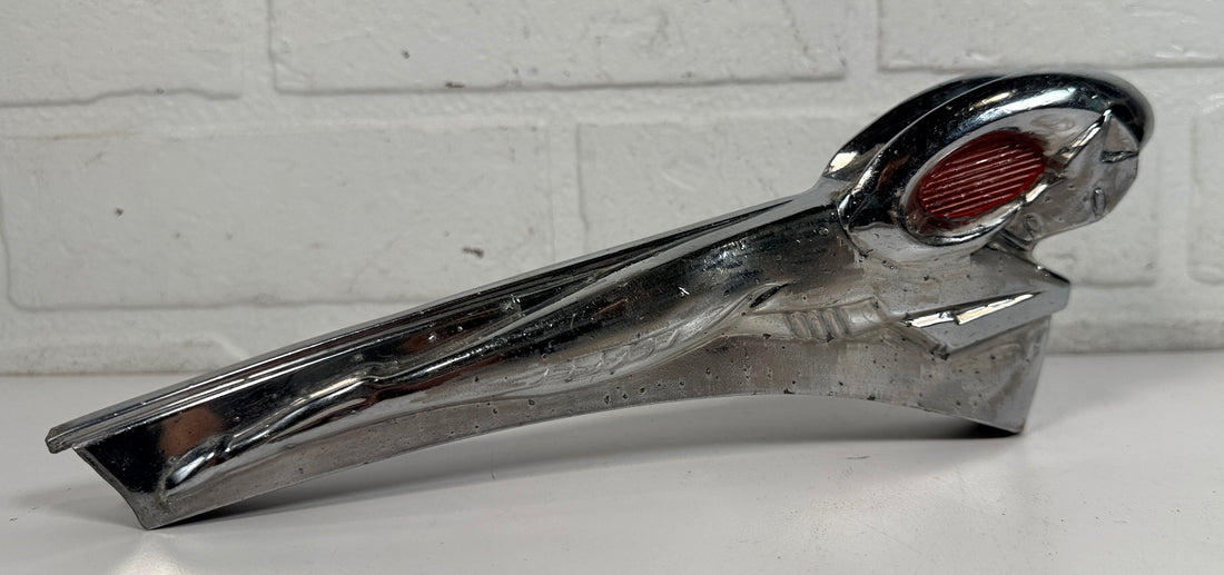 Vintage Dodge Ram hood ornament with red eyes, chrome mascot from the 1950s. Rare automobilia collectible for restoration, garage décor, or display