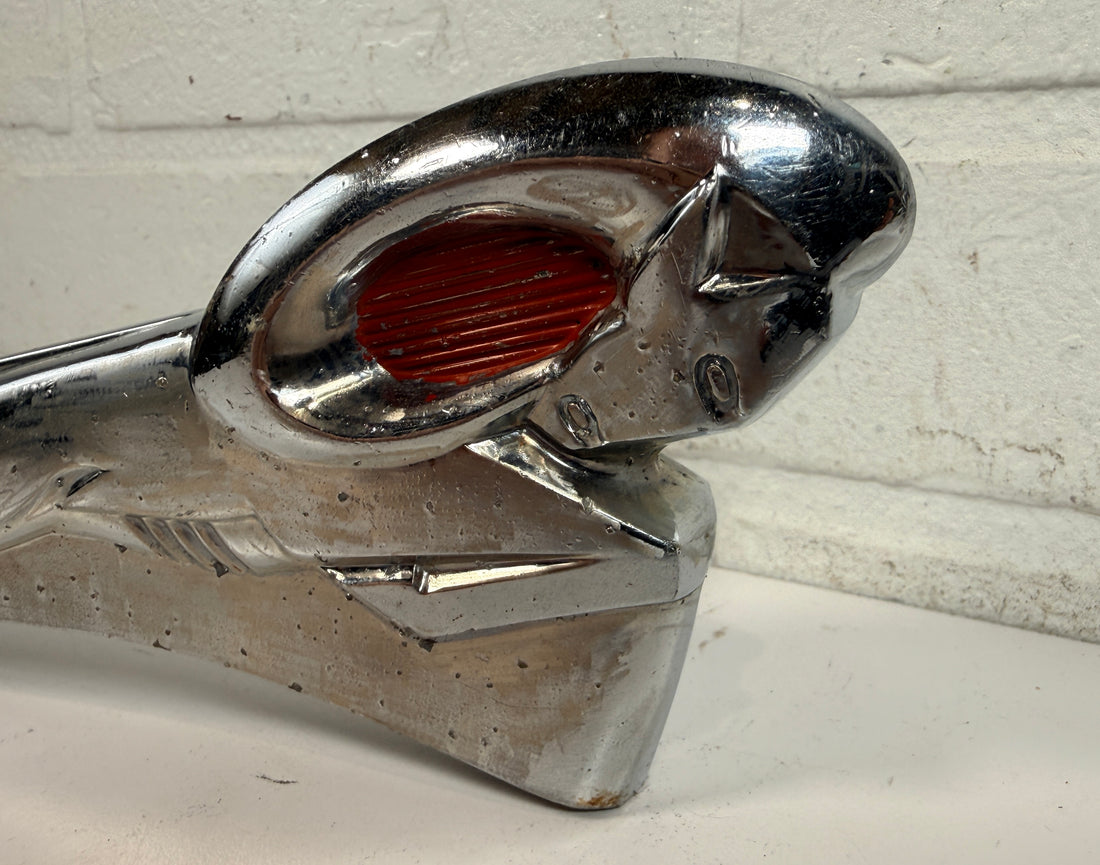 Vintage Dodge Ram hood ornament with red eyes, chrome mascot from the 1950s. Rare automobilia collectible for restoration, garage décor, or display
