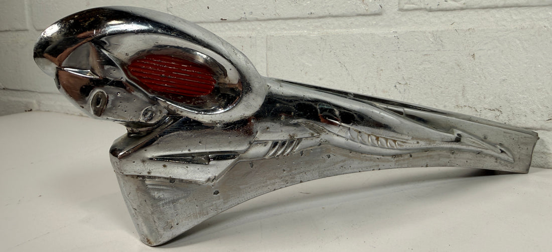 Vintage Dodge Ram hood ornament with red eyes, chrome mascot from the 1950s. Rare automobilia collectible for restoration, garage décor, or display