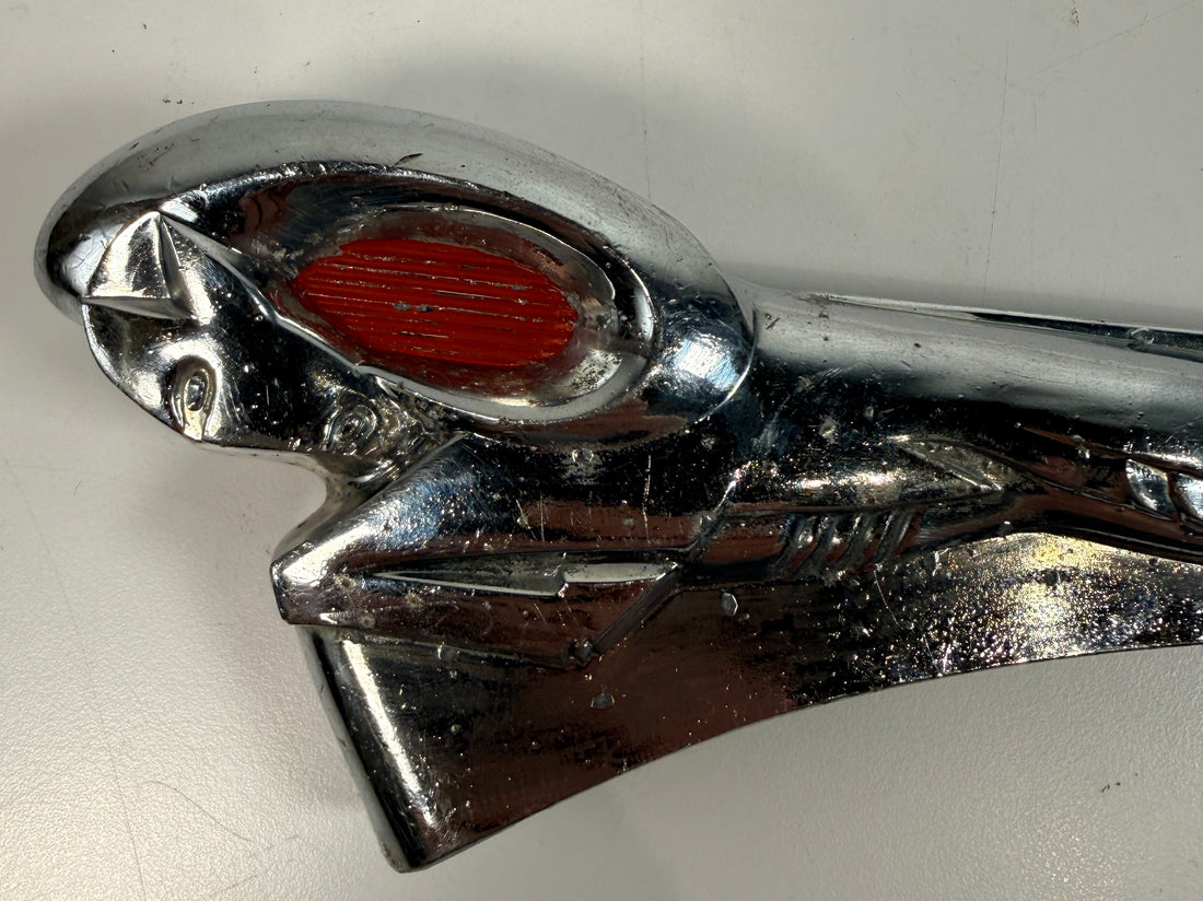 Vintage Dodge Ram hood ornament with red eyes, chrome mascot from the 1950s. Rare automobilia collectible for restoration, garage décor, or display