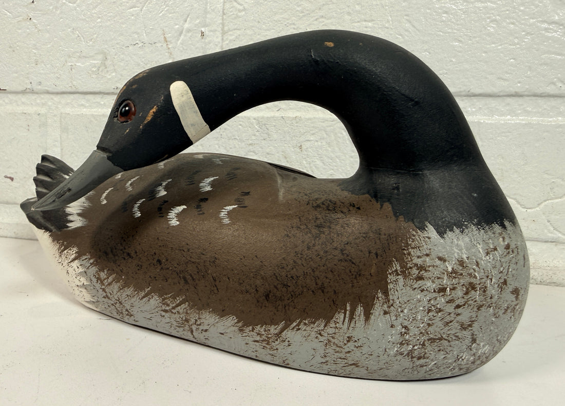 Vintage Canadian goose decoy sculpture signed J. Tremblay Canada. Hand-carved wood folk art bird with glass eyes and original label. Great cabin décor.