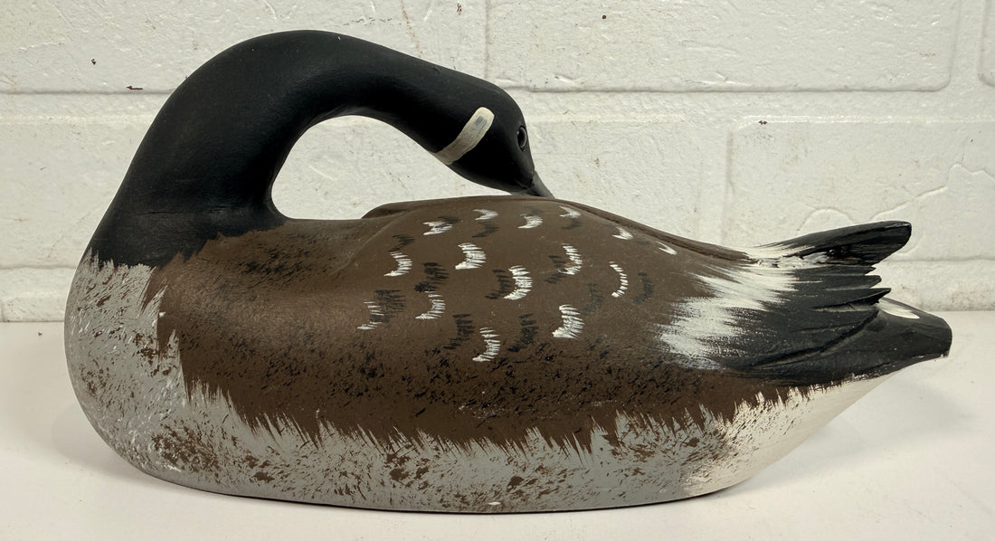 Vintage Canadian goose decoy sculpture signed J. Tremblay Canada. Hand-carved wood folk art bird with glass eyes and original label. Great cabin décor.