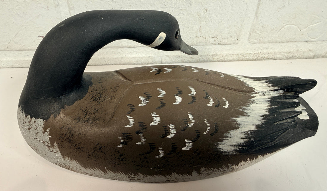 Vintage Canadian goose decoy sculpture signed J. Tremblay Canada. Hand-carved wood folk art bird with glass eyes and original label. Great cabin décor.