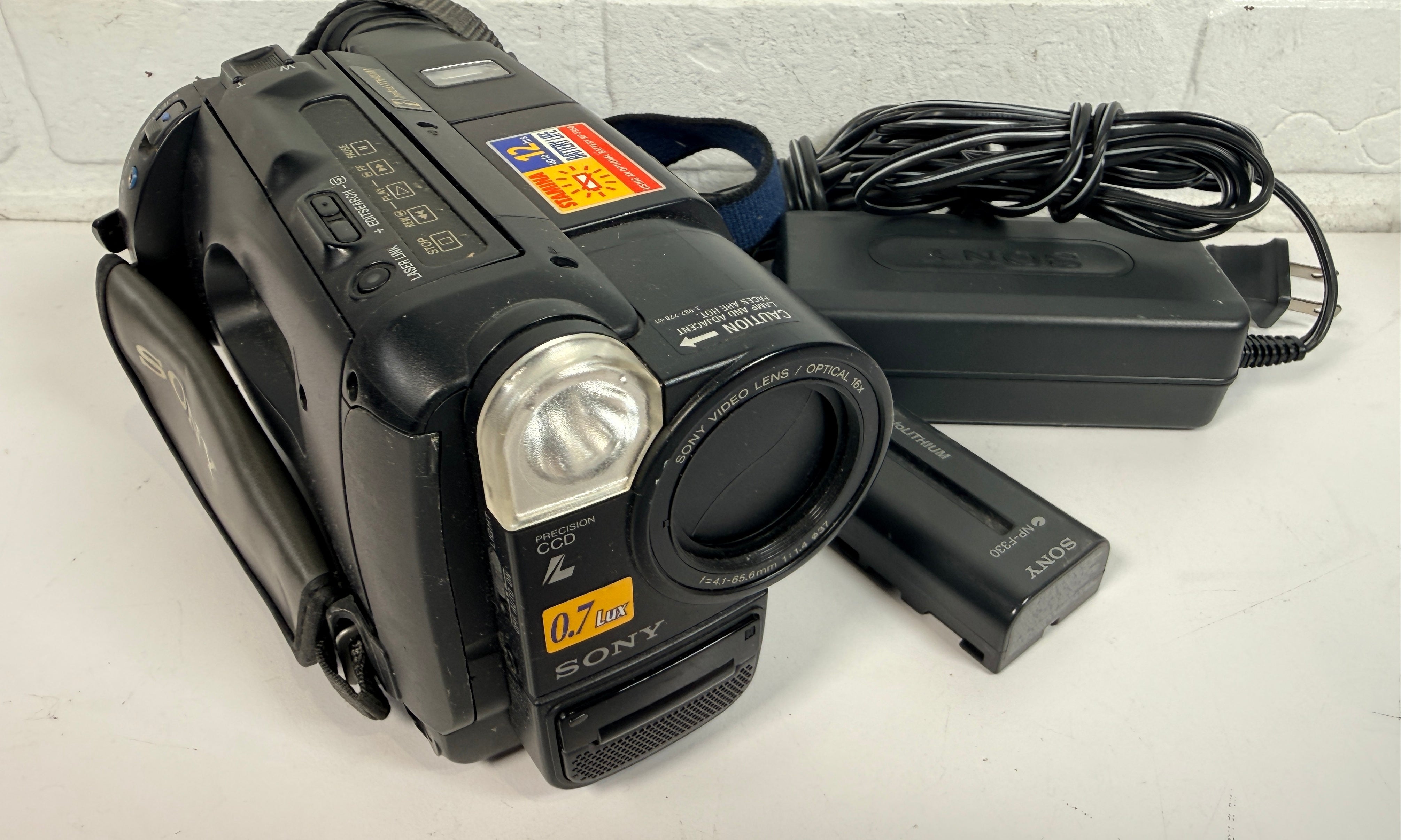 Sony CCD-TR87 Handycam Video8 XR camcorder with charger and battery. Untested vintage Sony camera sold as-is for repair, display or tape transfer use.