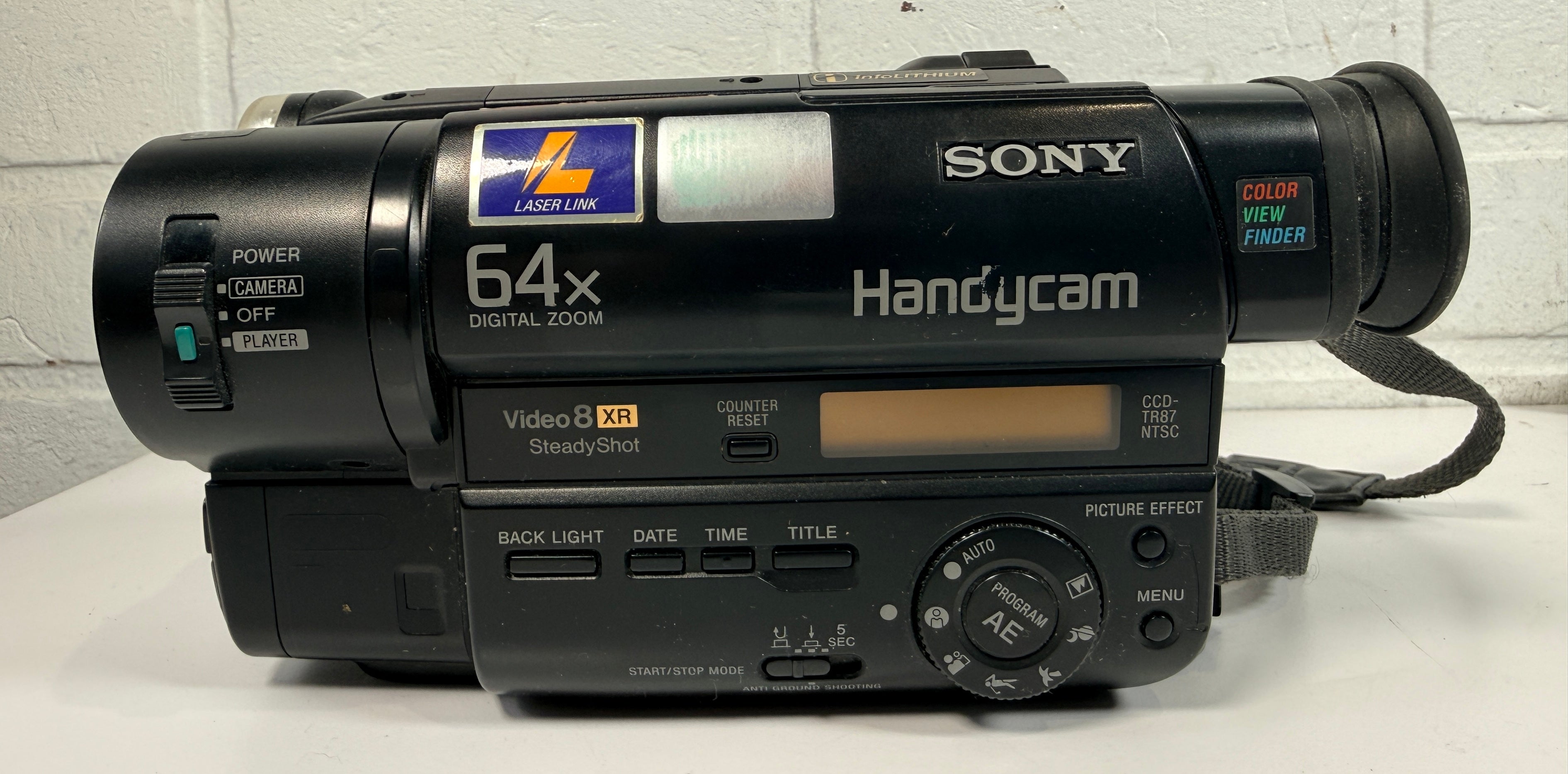 Sony CCD-TR87 Handycam Video8 XR camcorder with charger and battery. Untested vintage Sony camera sold as-is for repair, display or tape transfer use.