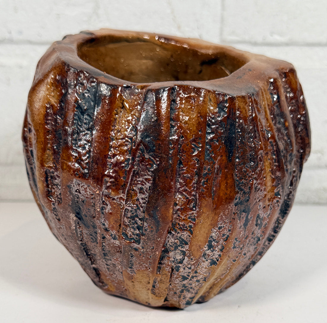 Vintage brutalist studio pottery planter with brown drip glaze and signed base. Mid-century handmade ceramic vessel for modern organic décor.