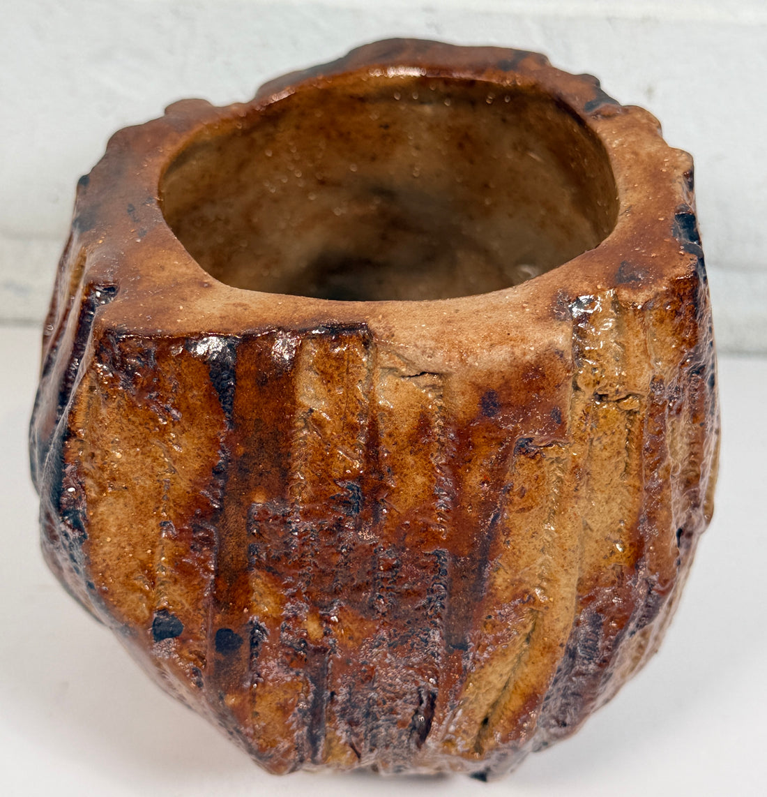 Vintage brutalist studio pottery planter with brown drip glaze and signed base. Mid-century handmade ceramic vessel for modern organic décor.
