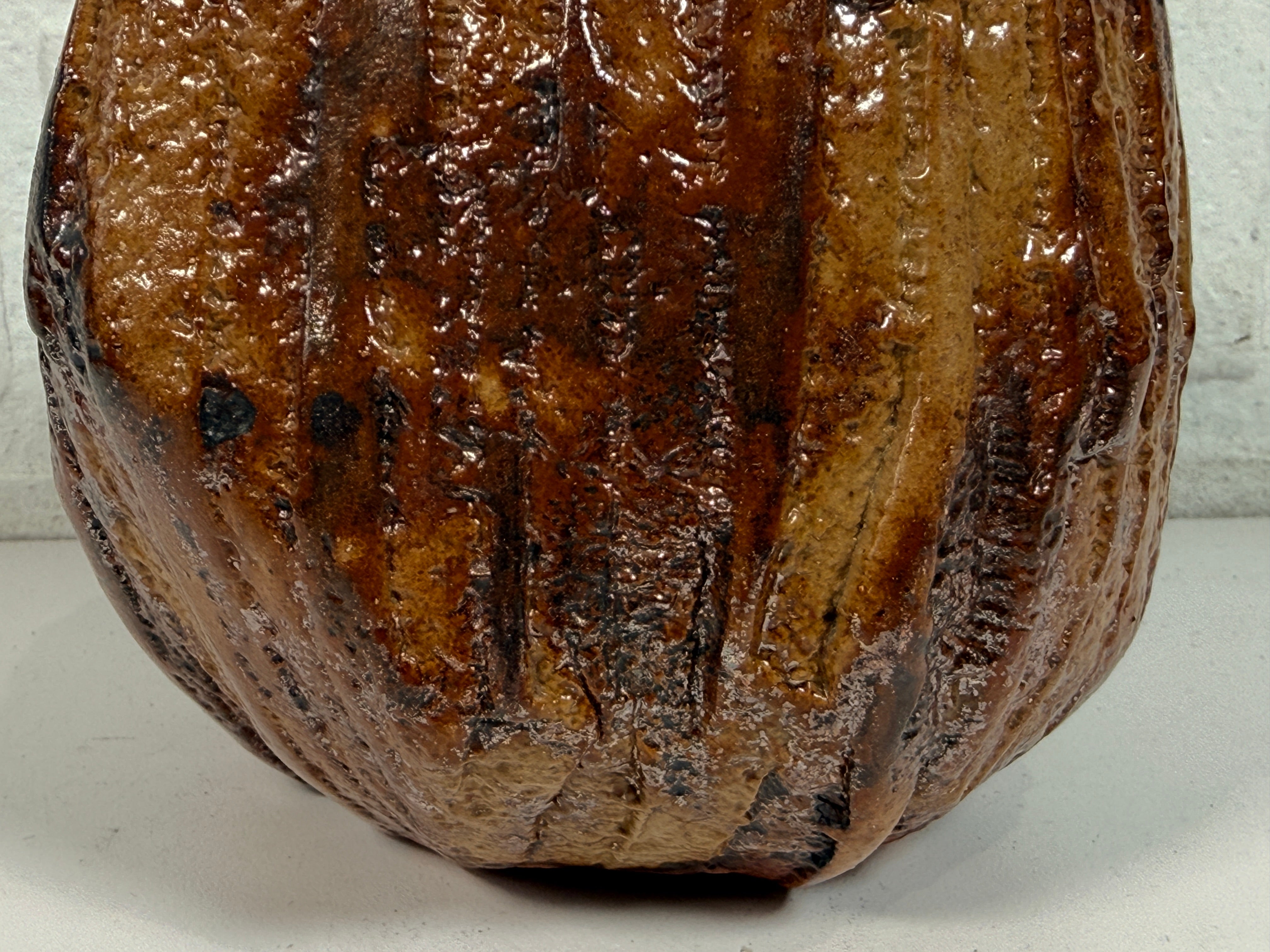 Vintage brutalist studio pottery planter with brown drip glaze and signed base. Mid-century handmade ceramic vessel for modern organic décor.