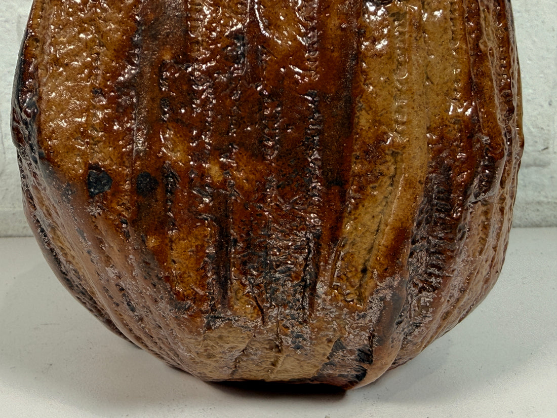 Vintage brutalist studio pottery planter with brown drip glaze and signed base. Mid-century handmade ceramic vessel for modern organic décor.
