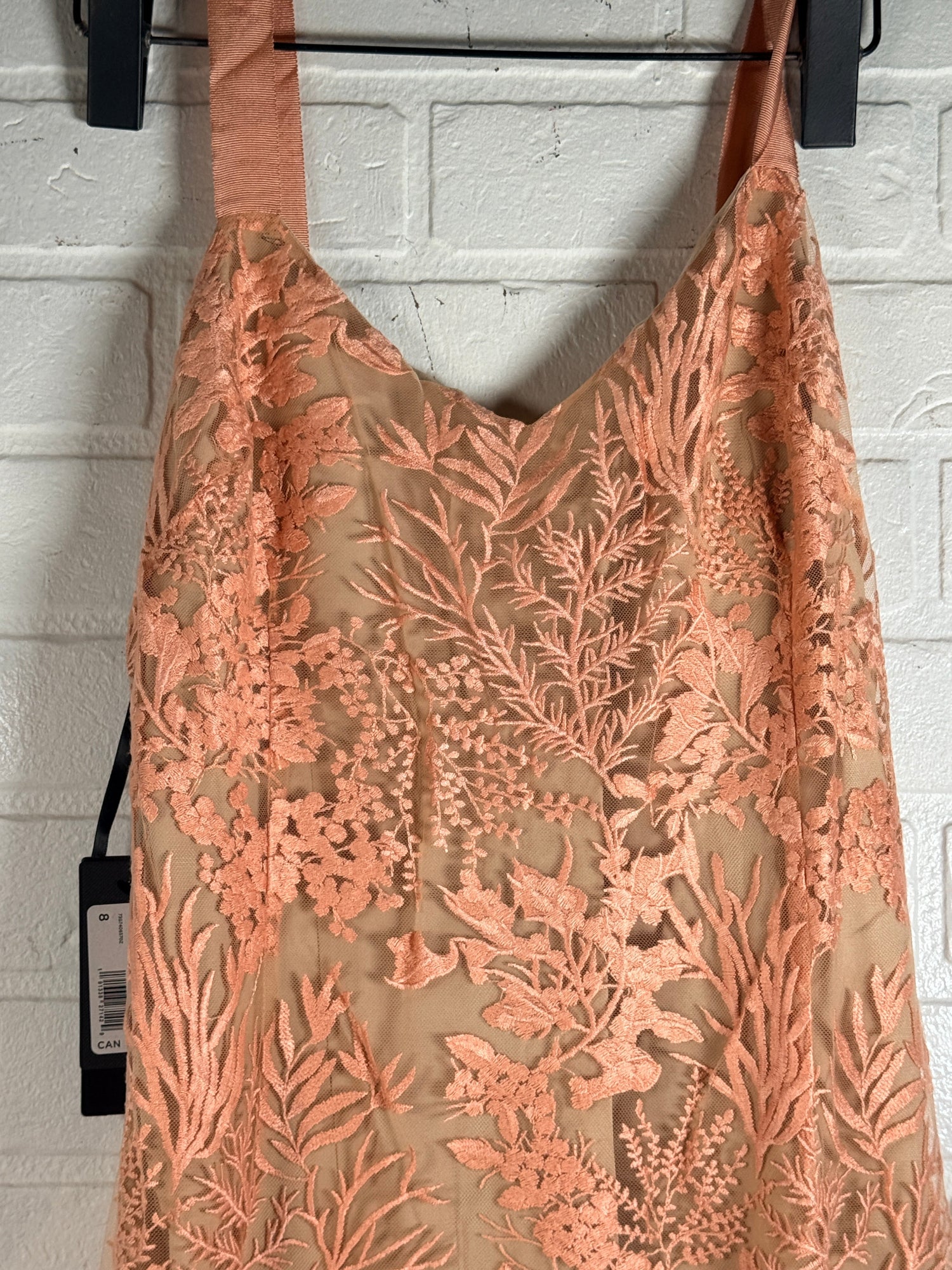 Marciano Kailey Dress size 8 in coral pink embroidered lace. Elegant formal gown with tags, fitted silhouette and sheer floral overlay.