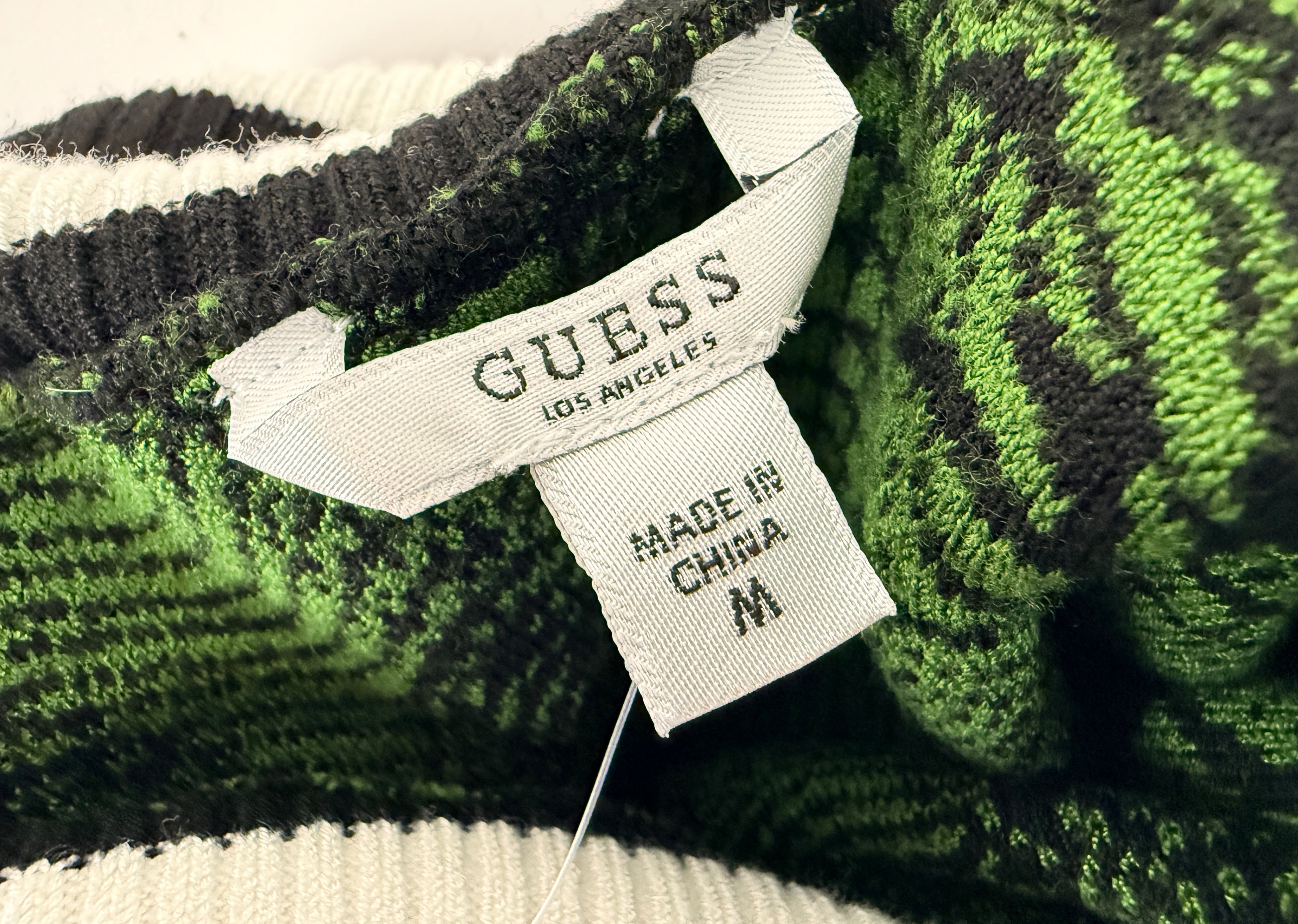 Guess Iris Jacquard sweater dress in green black optical knit. Sleeveless bodycon mock neck style, new with tags, size medium statement fashion piece.