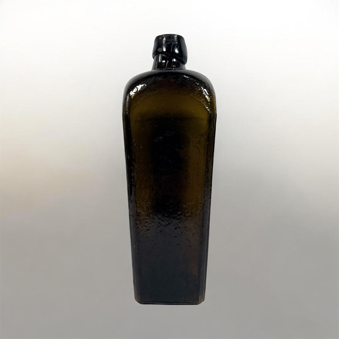 Collectible olive glass Case Gin bottle in classic Dutch jenever style. Square tapered vintage bottle perfect for bar decor, bottle collectors, and display.