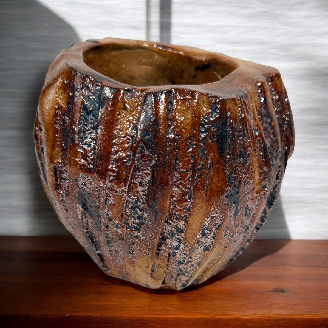 Vintage brutalist studio pottery planter with brown drip glaze and signed base. Mid-century handmade ceramic vessel for modern organic décor.