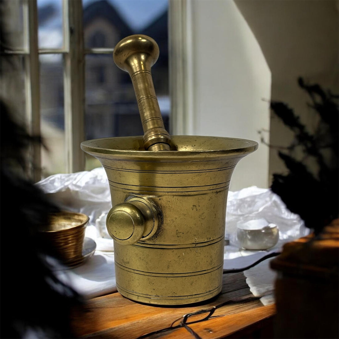 Vintage brass apothecary mortar and pestle, heavy cast with flared rim and rich patina. Classic pharmacy décor piece, functional and collectible.