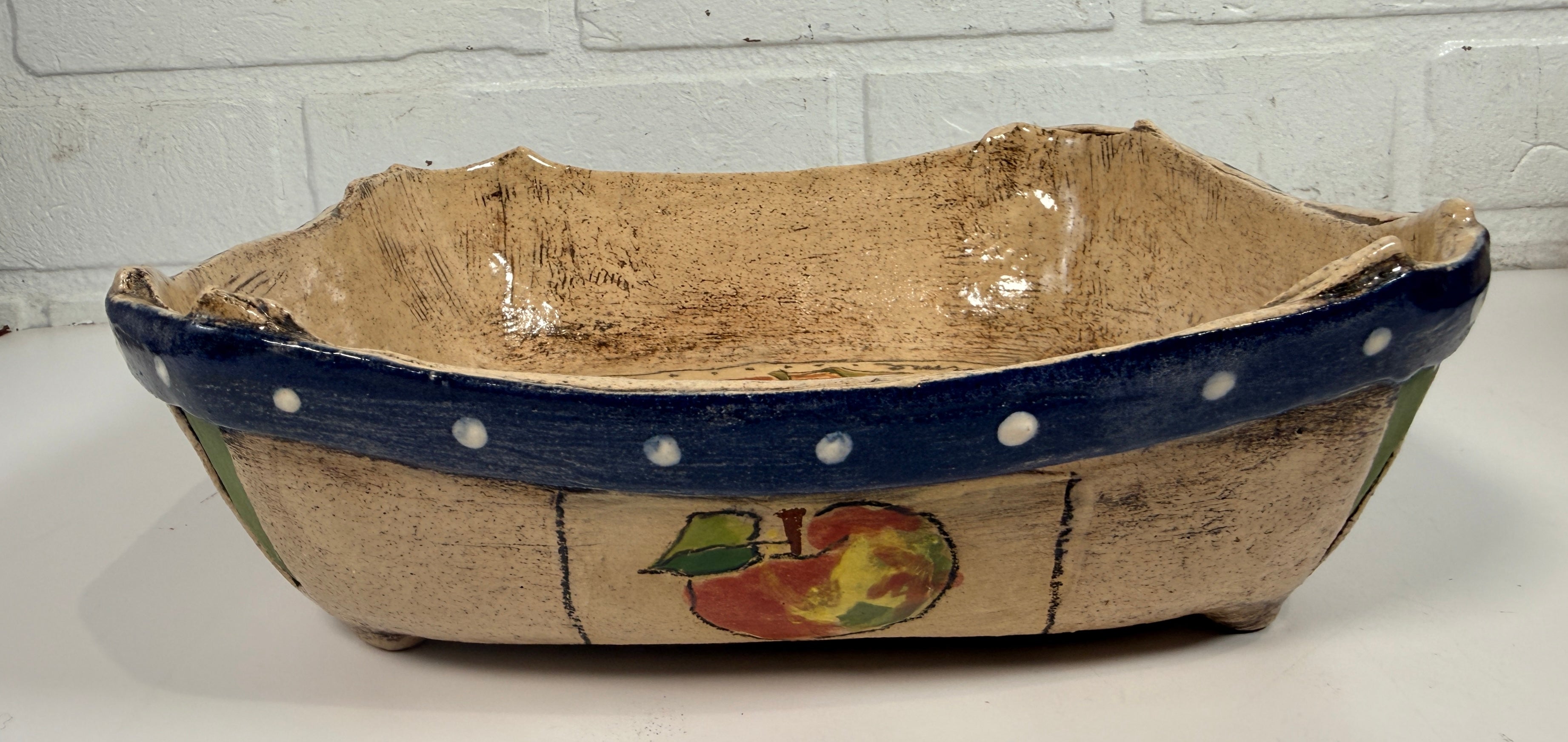 Signed studio pottery apple bowl with rustic farmhouse style, hand-painted ceramic fruit bowl, decorative artisan serving dish.