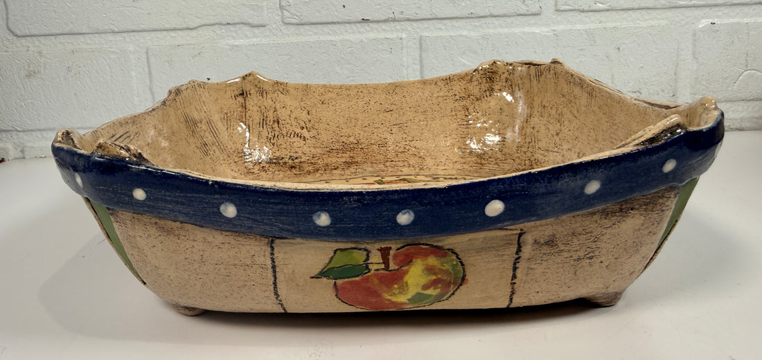 Signed studio pottery apple bowl with rustic farmhouse style, hand-painted ceramic fruit bowl, decorative artisan serving dish.