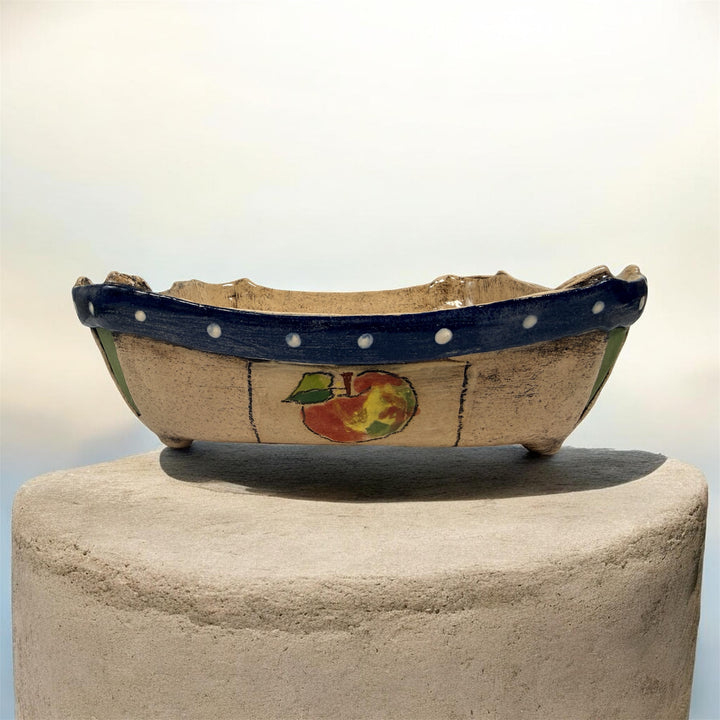 Signed studio pottery apple bowl with rustic farmhouse style, hand-painted ceramic fruit bowl, decorative artisan serving dish.