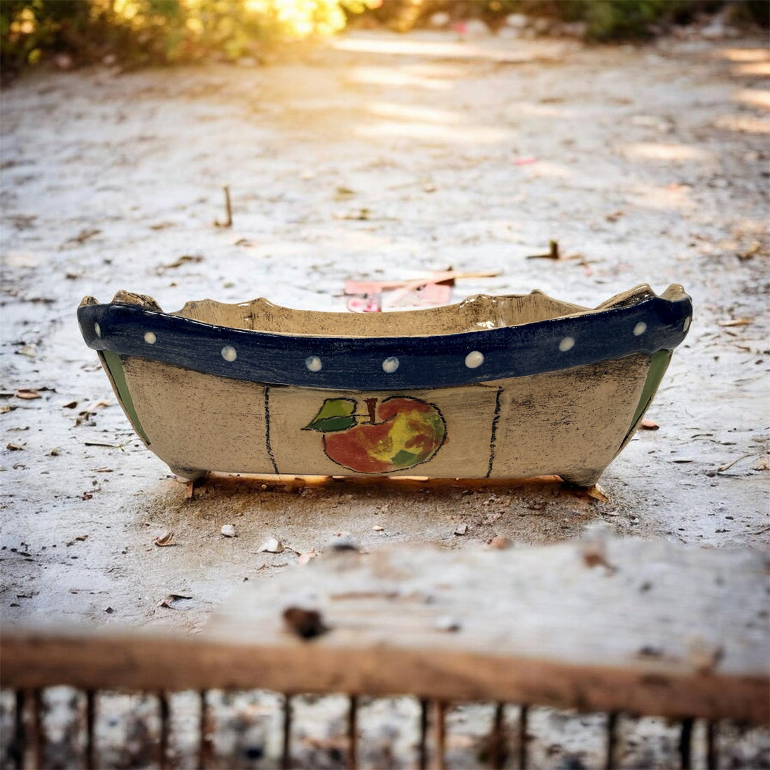 Signed studio pottery apple bowl with rustic farmhouse style, hand-painted ceramic fruit bowl, decorative artisan serving dish.