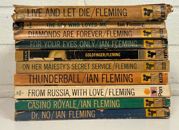Vintage James Bond Ian Fleming paperback lot of 10 Pan Books editions with classic 007 cover art. Great collectible shelf display set for Bond fans.
